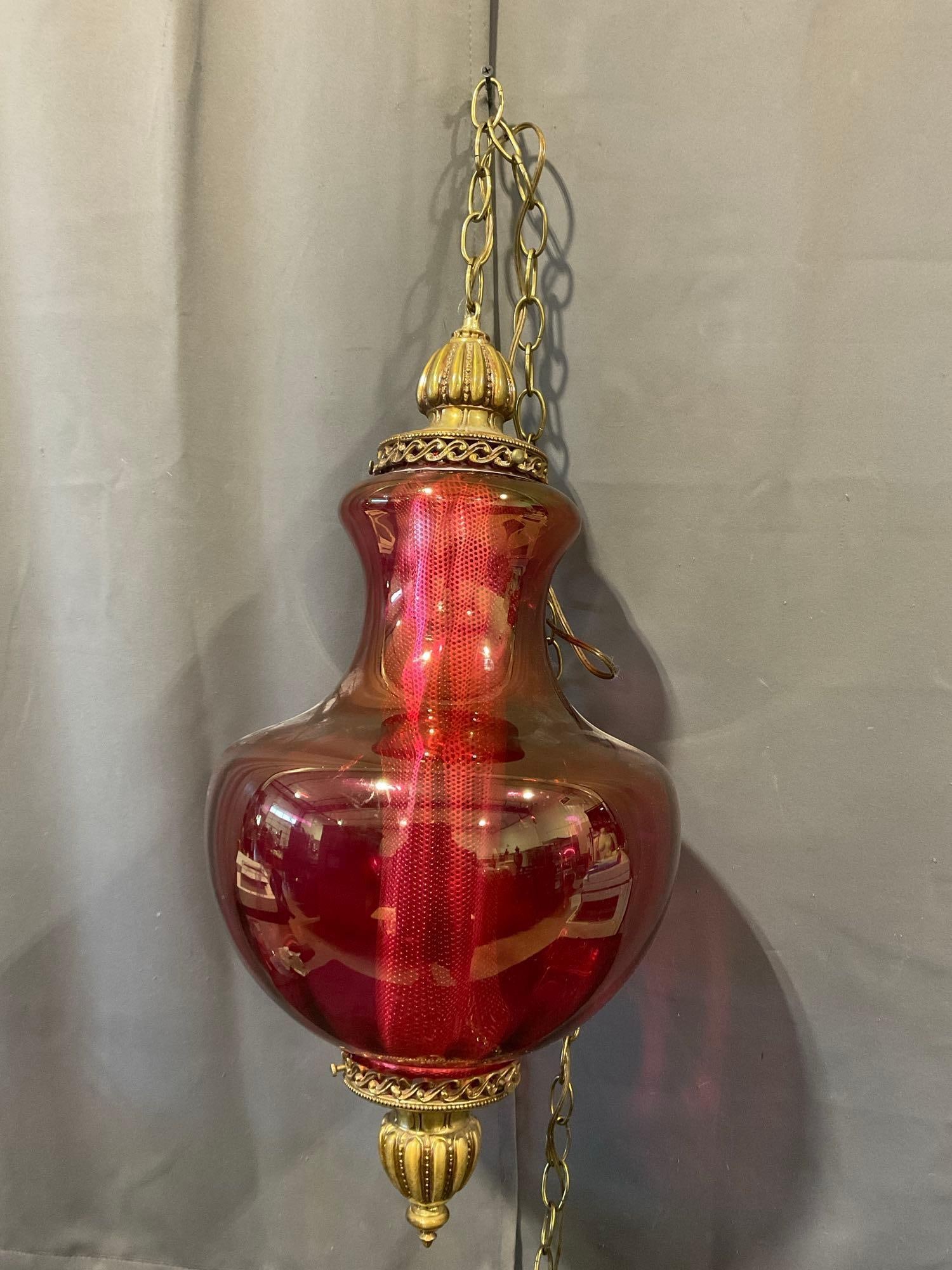 Vintage Ruby Red Glass Swag Lamp, Ornate Brass Finials on either side, 24 in + Chain, tested work...: Appears to be in good shape, tested & working. The piece measures approx 24h x 12w x 12d inches. See pics. E-6610 *Oversized shipping may apply*