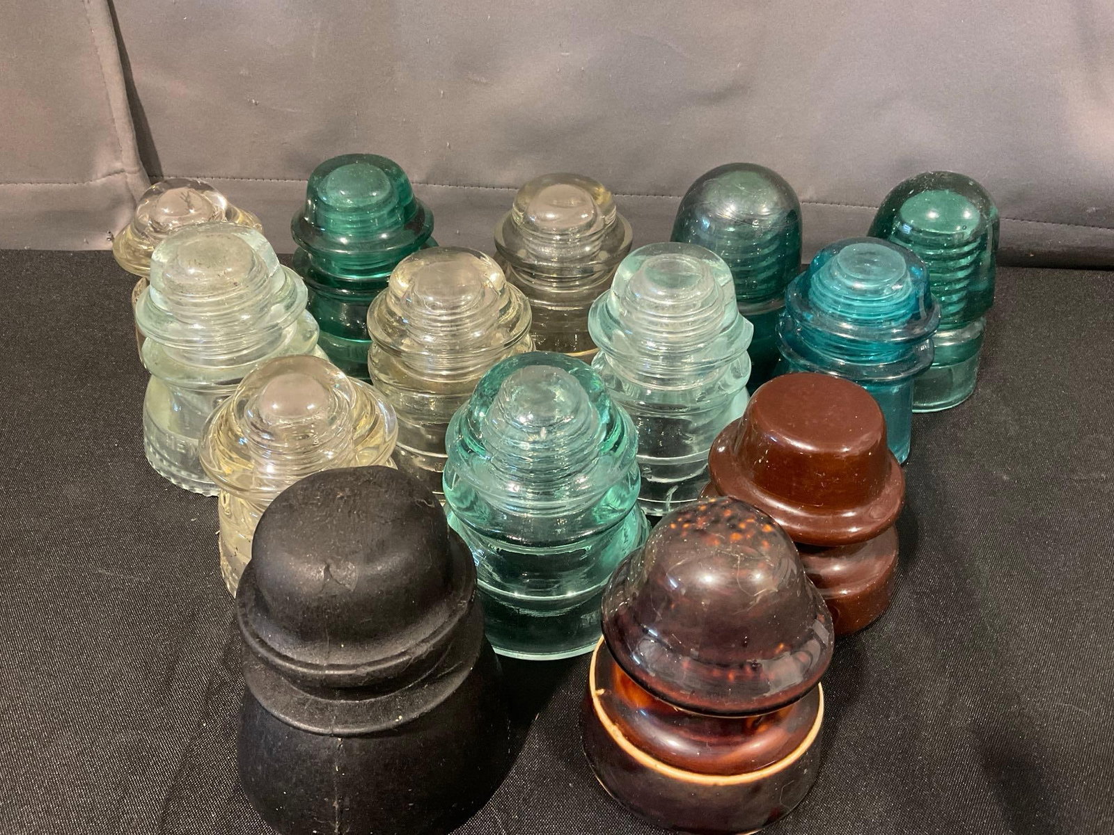 Set of 14 Vintage Insulators, Hemingray & more, lovely blue & clear Glass & brown ceramic: Appears to be in good shape. The piece measures approx 6h x 18w x 12d inches. See pics. E-6610