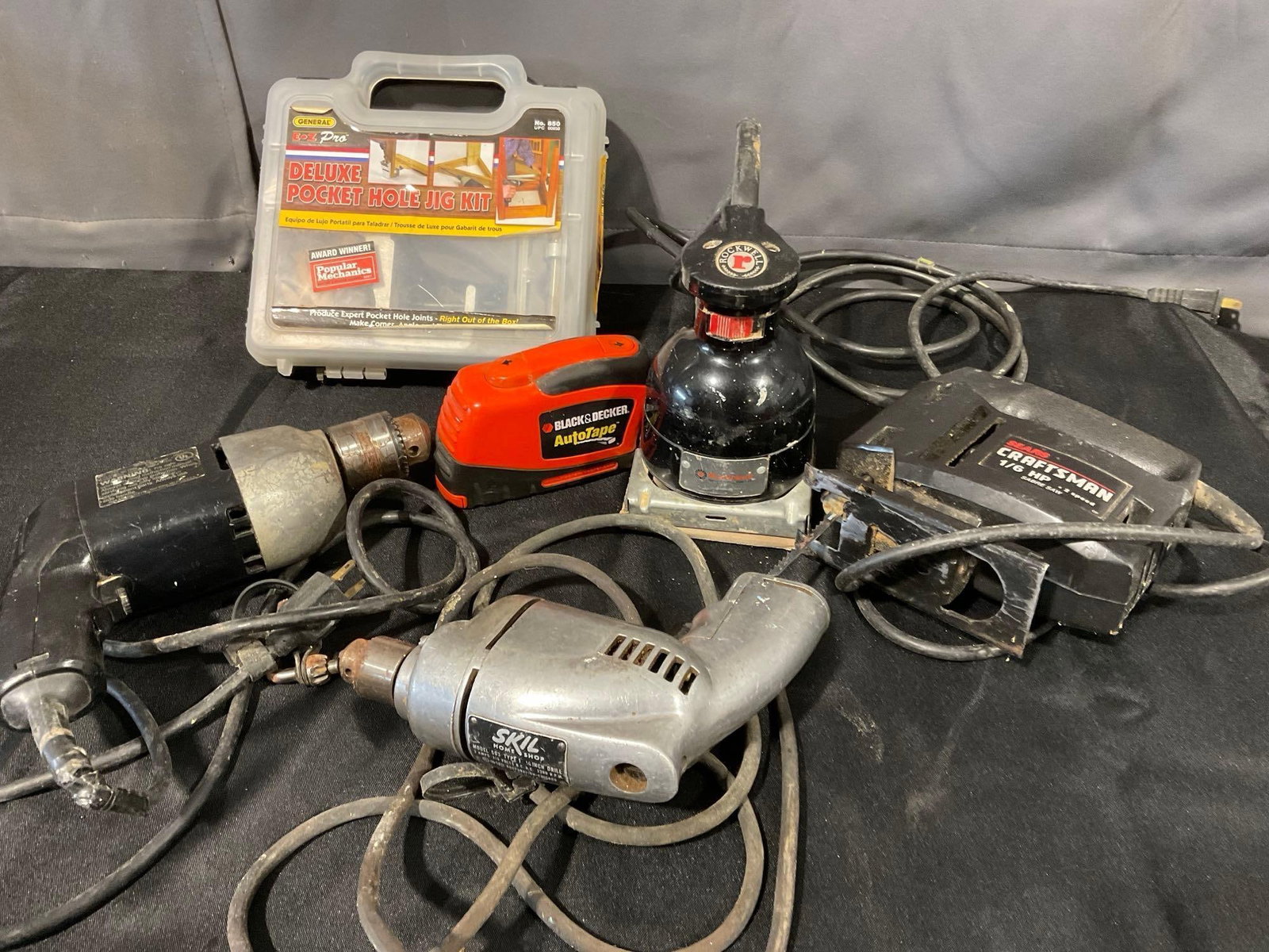 Variety of Tools, Skil Model 503, Black & Decker no. 7254, Rockwell 330A Sander, & more: Appears to be in good shape. The piece measures approx 13h x 16w x 12d inches. See pics. E-6340