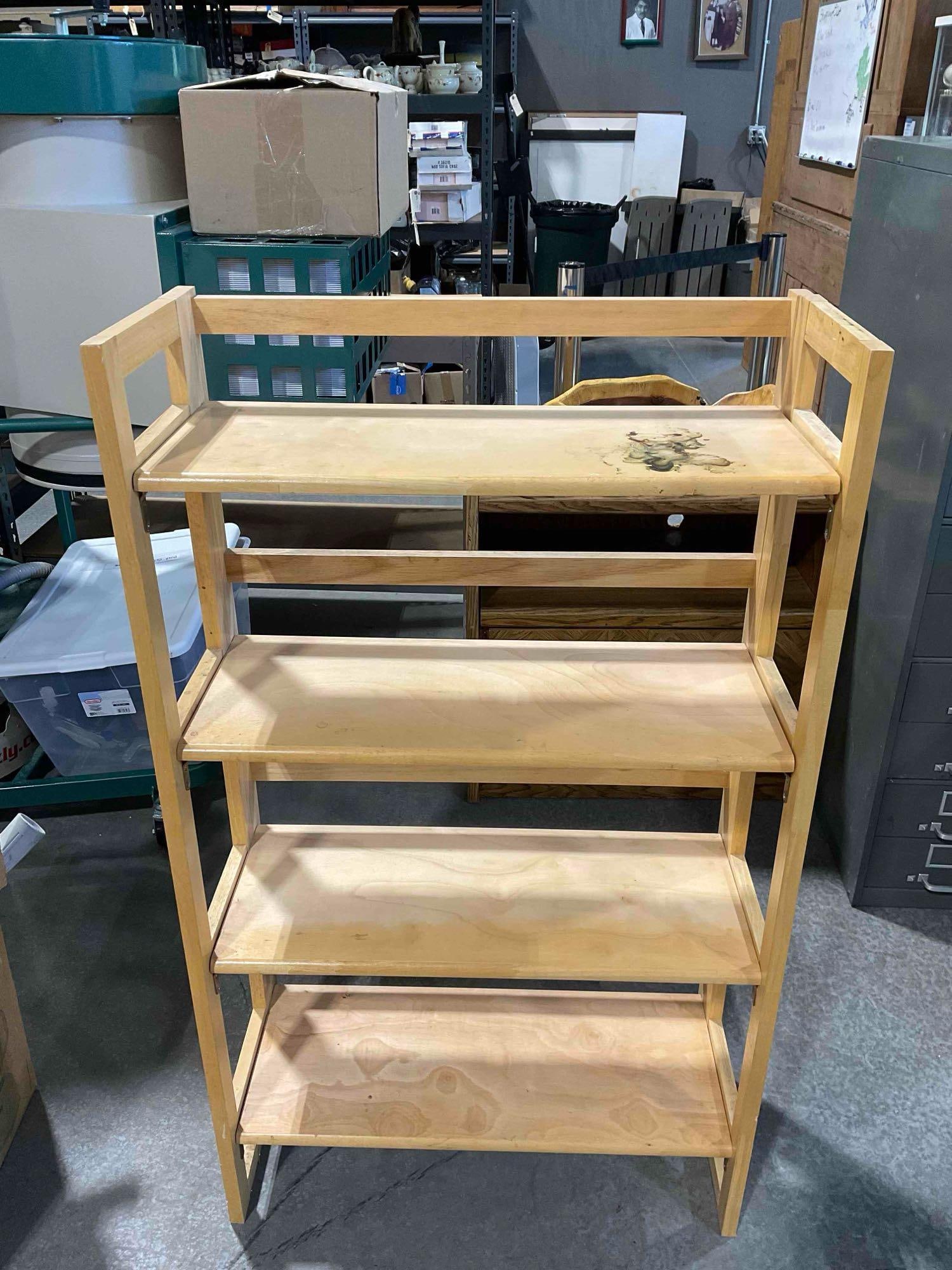 Modern 4-Tier Blonde Pine Wood Folding Bookcase. Fair Condition. Measures: Modern 4-Tier Blonde Pine Wood Folding Bookcase. Fair Condition. Piece has wear and staining indicative of age and use, otherwise looks to be in fair condition. Measures 28" x 12" x 48"