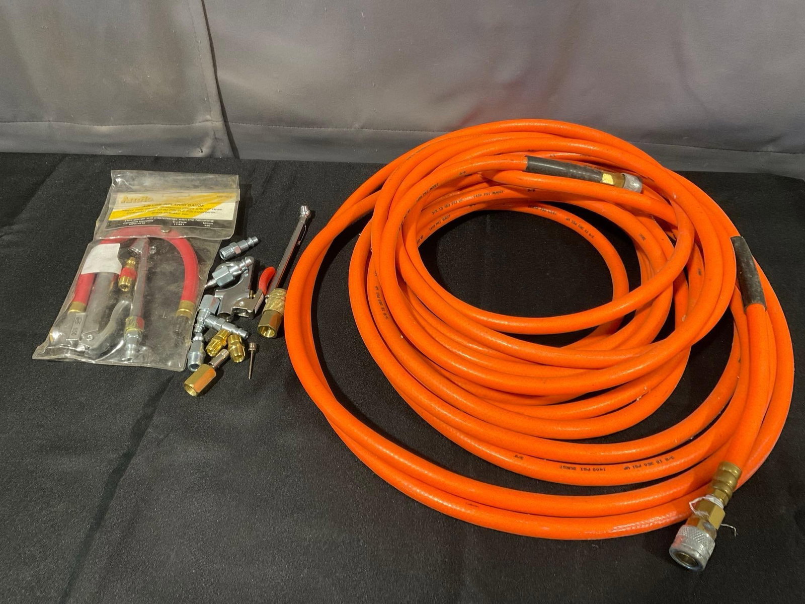 100ft Air Compressor Hose 1400 psi capacity, w/nozzles & connectors: Appears to be in good shape. The piece measures approx 19h x 19w x 6d inches. See pics. E-6340