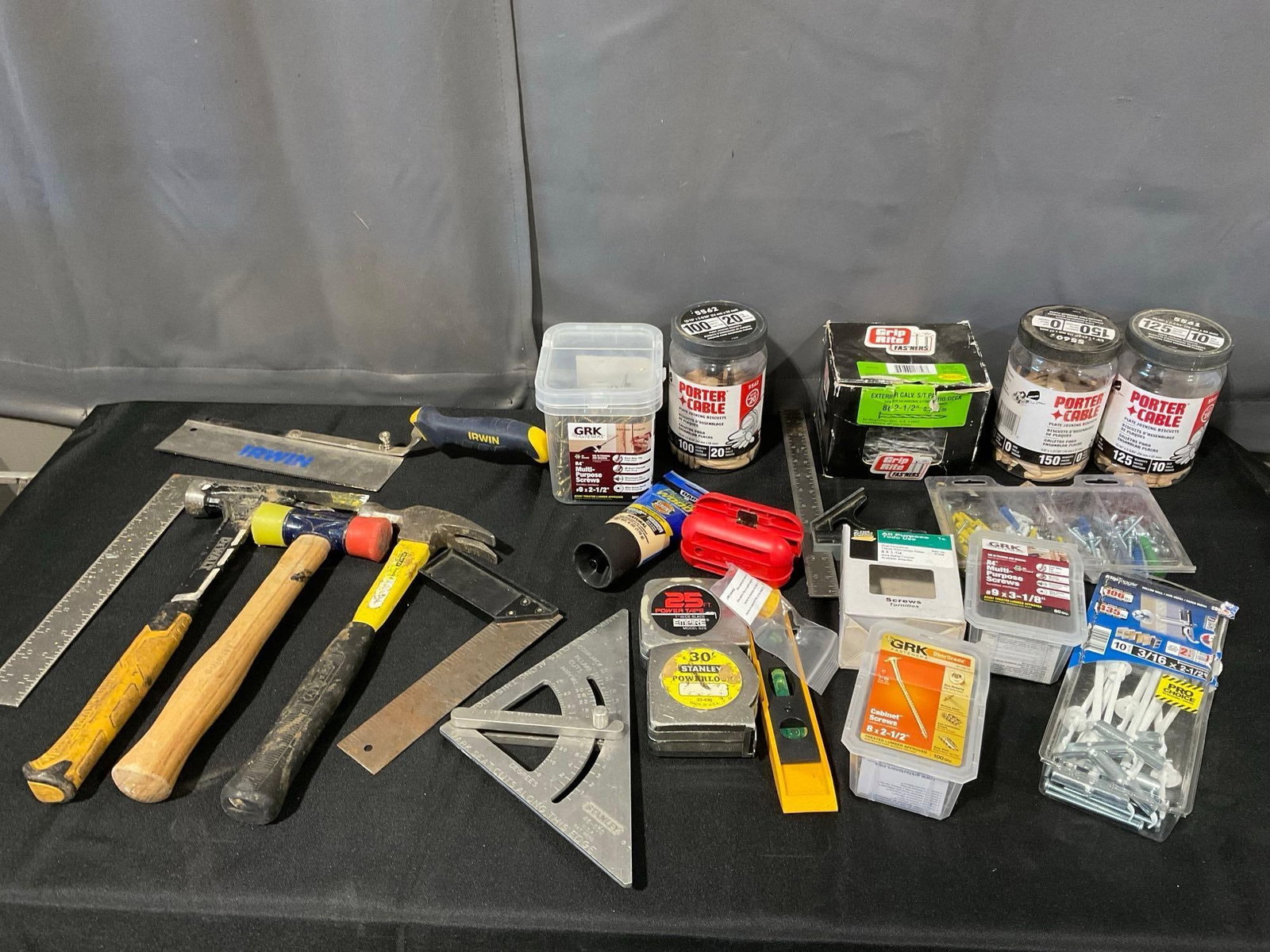 Variety of Tools, Hammers, Squares, Tapes, Jointing Biscuits, Saw & more: Appears to be in good shape. The piece measures approx 13h x 23w x 17d inches. See pics. E-6340 *Oversized shipping may apply*