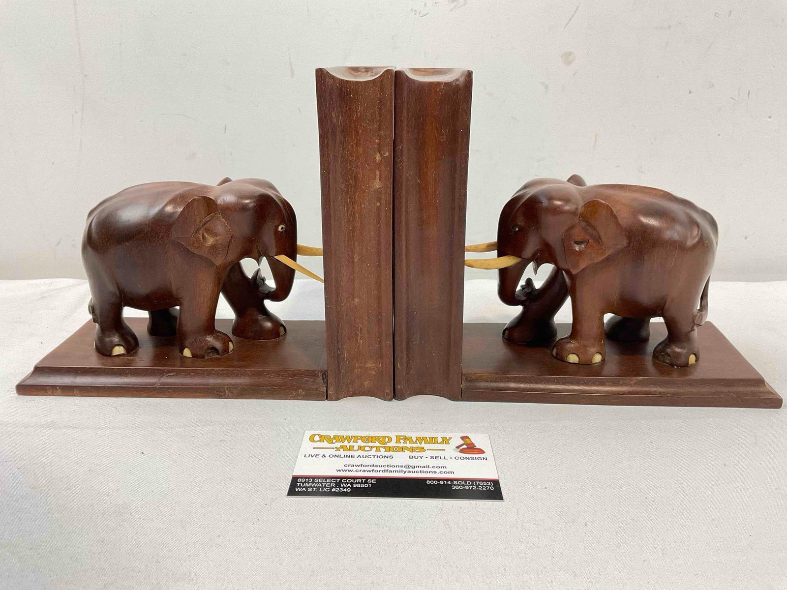Vintage Charming Carved Mahogany? Wooden Elephant Bookends. Fair Condition. See pics.: Vintage Charming Carved Mahogany? Wooden Elephant Bookends. Fair Condition. One elephant has lost two toenails and its trunk is misaligned, both have minor wear indicative of age and use, otherwise