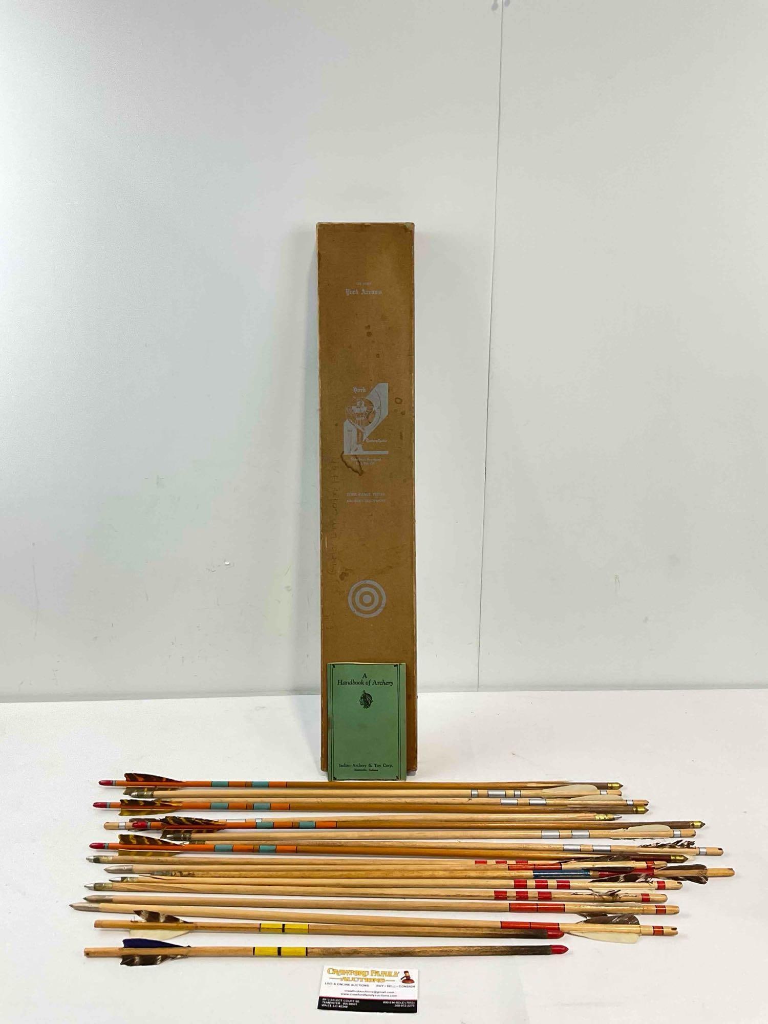 18 pc Vintage Wood & Feather Archery Arrows w/ York Arrows Box & A Handbook of Archery.: 18 pc Vintage Wood & Feather Archery Arrows w/ York Arrows Box & A Handbook of Archery. Feathers on some feathers are tired, wood of one arrow is split, otherwise look to be in fair