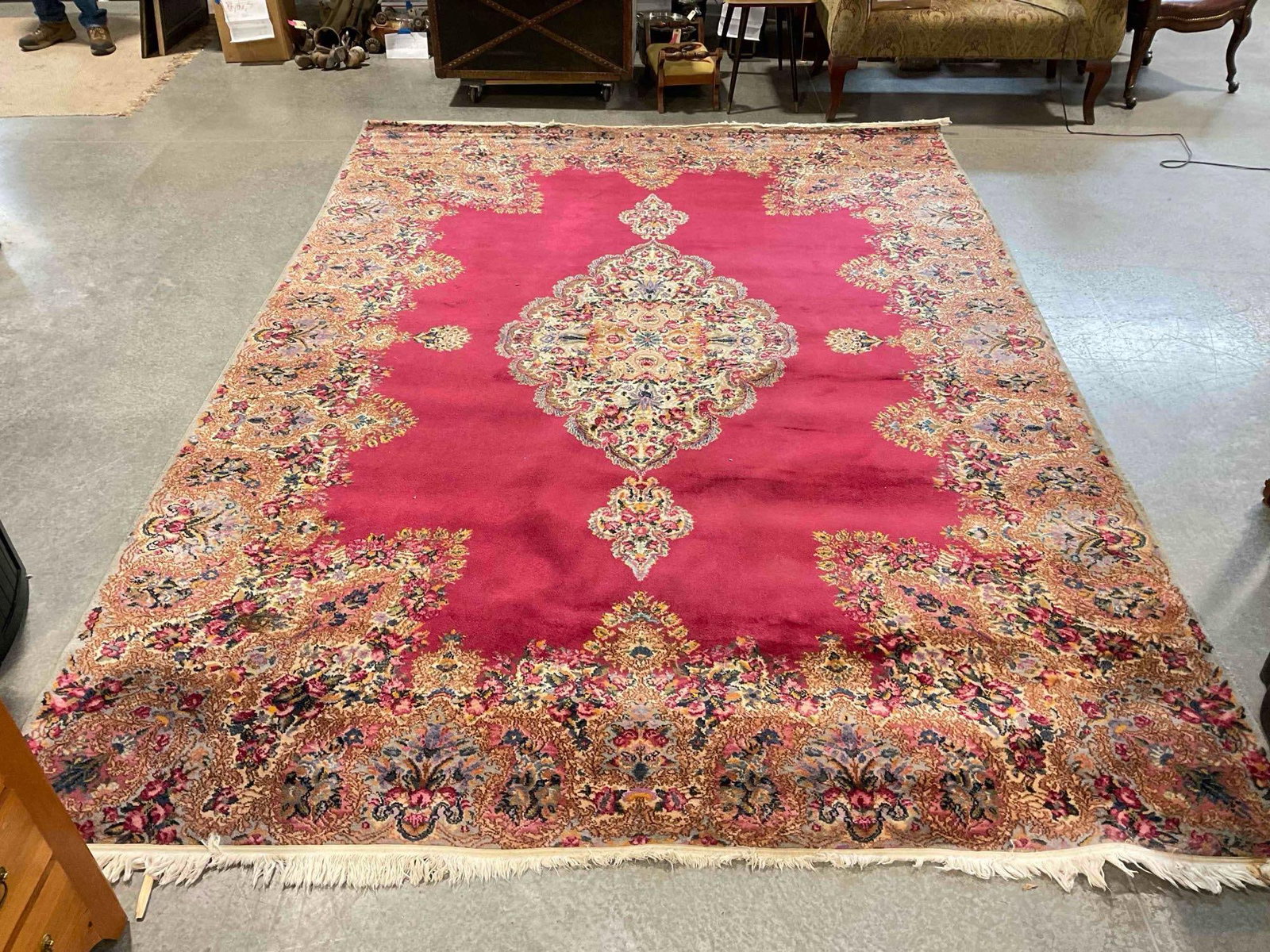 Vintage Karastan Burgundy & Gold Wool Pile Persian Rug in Kirman Style. 108" x 144": Vintage Karastan Burgundy & Gold Wool Pile Persian Rug in Kirman Style. 108" x 144" Piece has wear indicative of age and use, tassels on one end are tired, look to pictures for condition. DM-6560