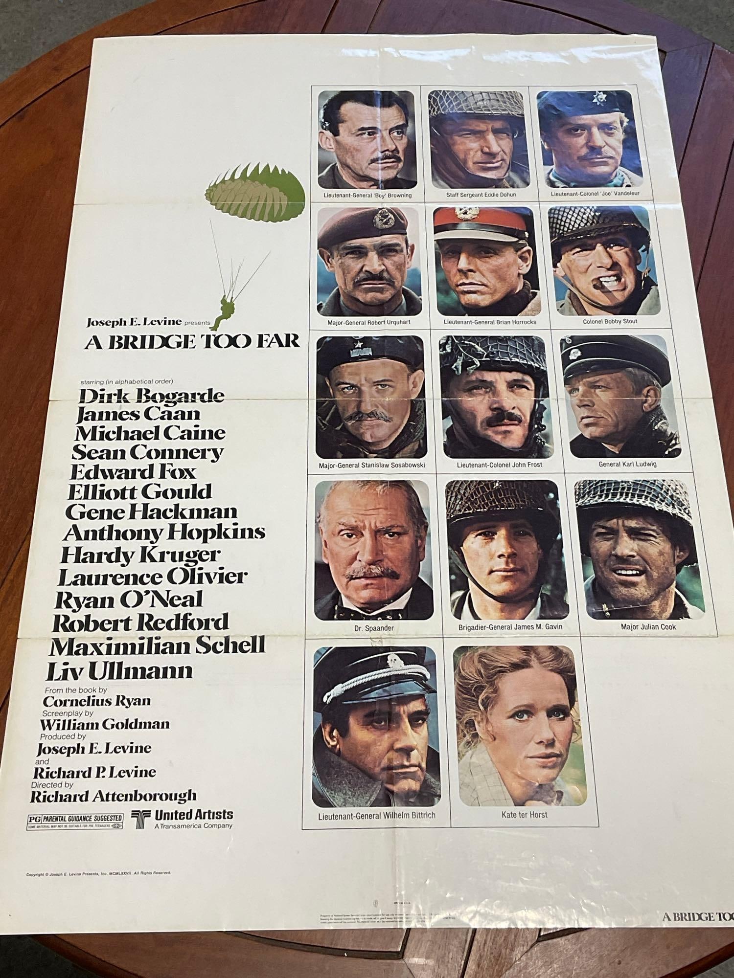 Vintage One Sheet Movie Poster, 1977 A Bridge Too Far, w/14 Photos of Cast: Marked 77/28. Vintage posters are in as is condition, consistent with age, see pics for condition. The poster measures approx 41h x 27w x 1d inches when laid flat. E-6640