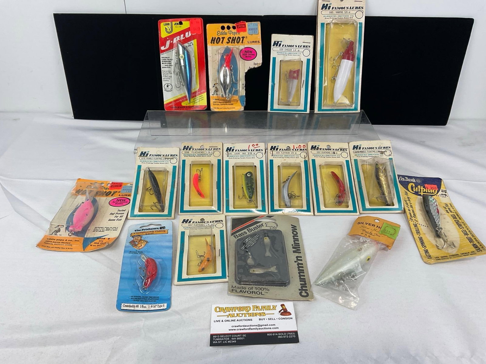 Assortment of Vintage Lures, HI Famous Lures, Flatheads, Lucky Bug, Vampire & more in packaging: The packaging shows some wear. The piece measures approx 6h x 11w x 9d inches. See pics. E-6610