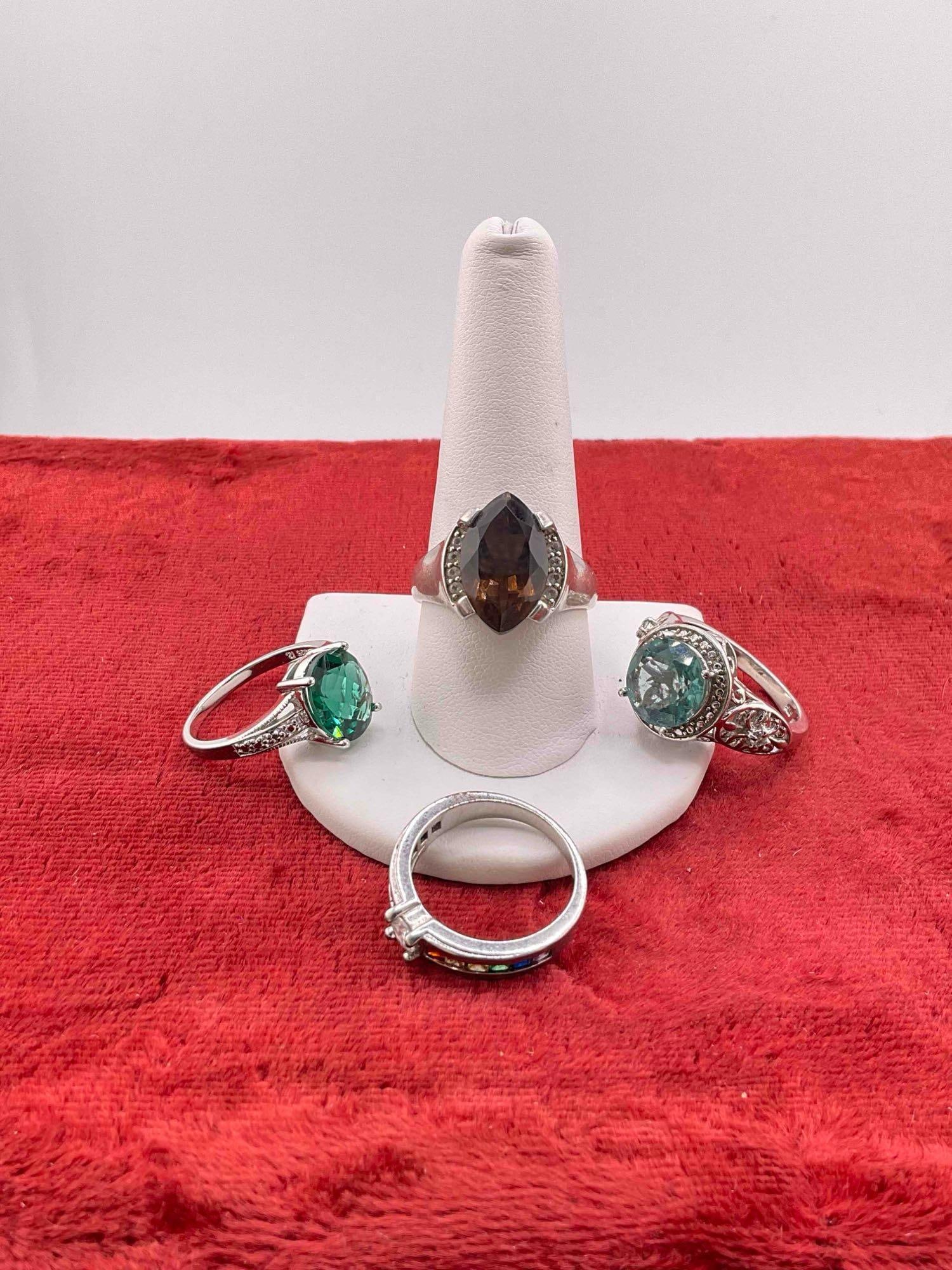 4 pcs Sterling Silver Rings w/ Colorful Stone Settings. Assorted Sizes.: 4 pcs Sterling Silver Rings w/ Colorful Stone Settings. Assorted Sizes. Weigh 17 grams. DM-1554