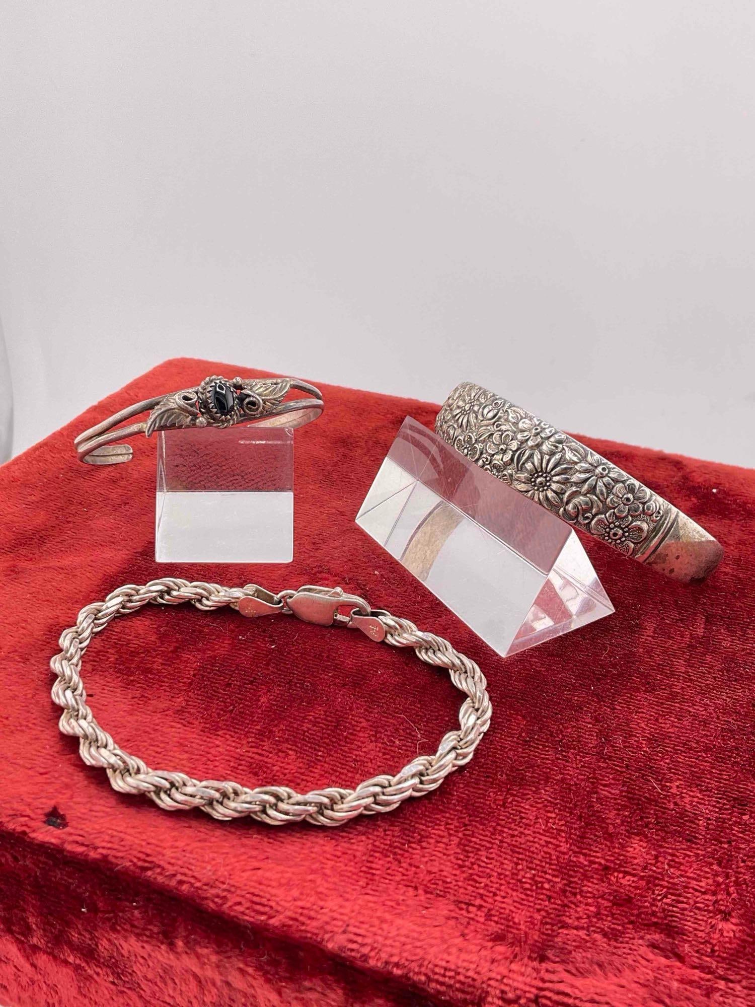3 pcs Vintage Sterling Silver Bracelets, 2x Cuffs & 1x Chain.: 3 pcs Vintage Sterling Silver Bracelets, 2x Cuffs & 1x Chain. One has what looks like a black onyx toned setting. Weighs 49 grams. dm-1554