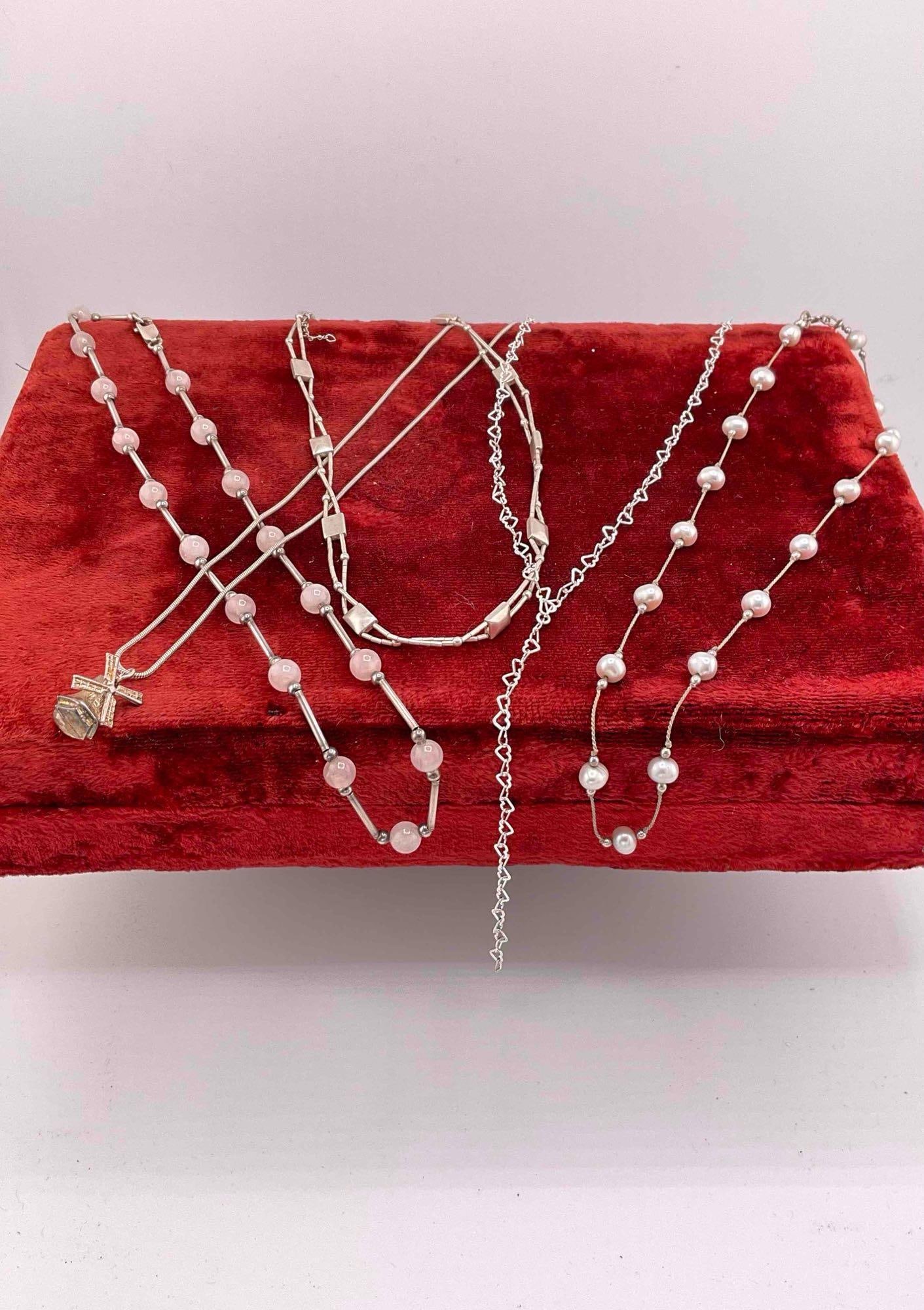 4 pcs Sterling Silver Necklaces & 1x Knotted Pearl Necklace.: 4 pcs Sterling Silver Necklaces & 1x Knotted Pearl Necklace. One silver necklace has rose quartz toned beads. Pearl necklace has sterling findings and beads. Necklaces measure a range from