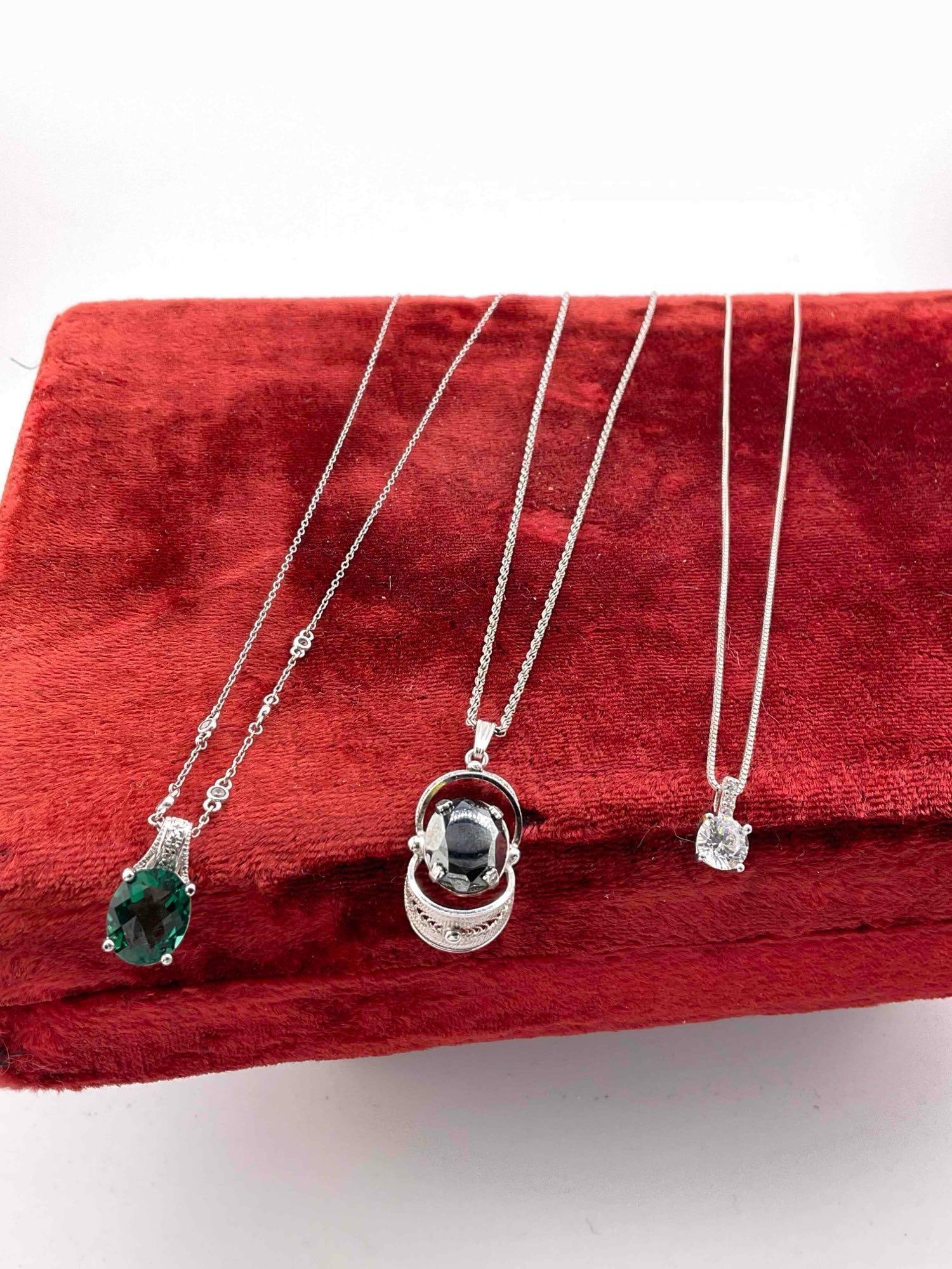 3 pcs Sterling Silver Necklaces w/ Colorful Stone Toned Pendants.: 3 pcs Sterling Silver Necklaces w/ Colorful Stone Toned Pendants. Measures 18-23". Weighs 15 grams. DM-1554