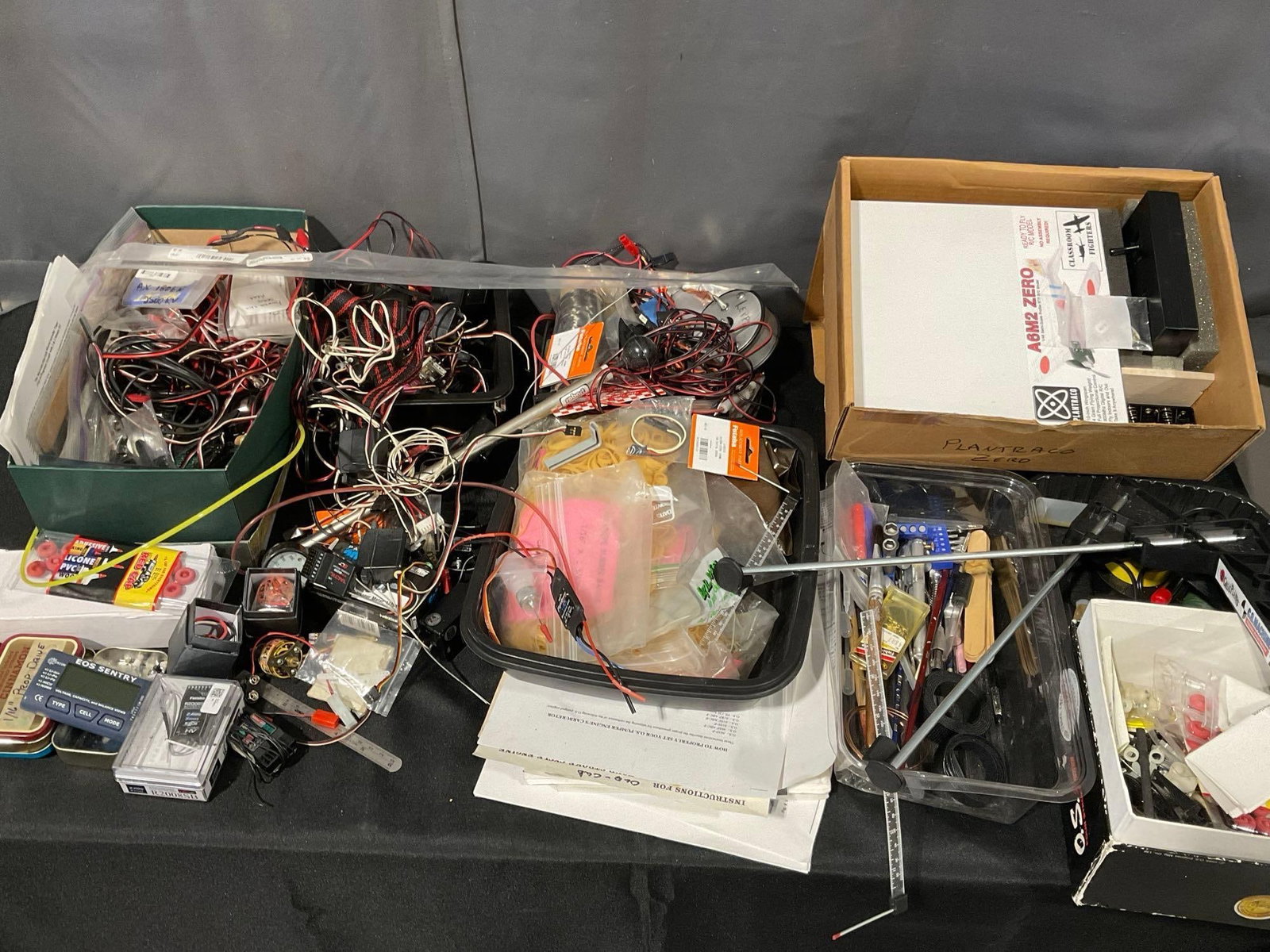 Large Assortment of Model Airplane Parts, Wires, Computers, Small Motors, Model making Equipment: Lots of unresearched pieces included. See pics for condition. Measures approx 18h x 20w x 20d inches. E-6260