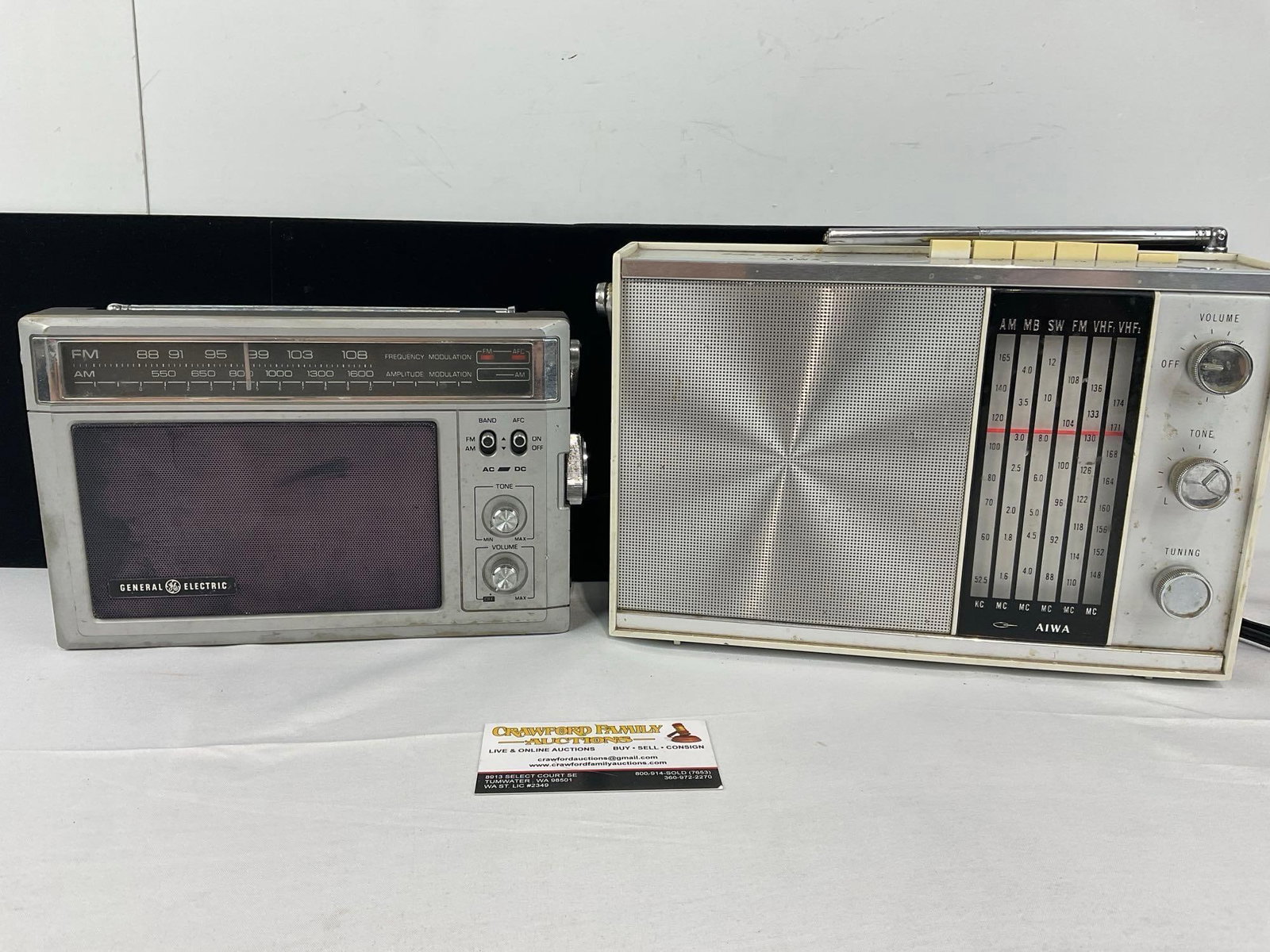 Pair of Vintage General Electric Model No. 7-2850A & Aiwa Solid State 6 Band model AR-158 Radios: See pics for condition. Shows some wear, and both are untested. Measures approx 9h x 7w x 12d inches. E-6610