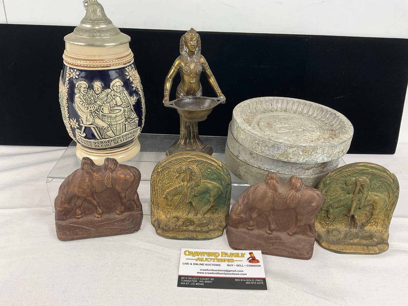 German Salt Glazed Stein, 4 Small Cast Metal Bookends, 2x End of the Trail Brass, 3 Stone Molds: Unique Molds w/Large M or W, unclear what kind of stone they are, has some wear. See pics for condition. Measures approx 8h x 10w x 10d inches. E-6610
