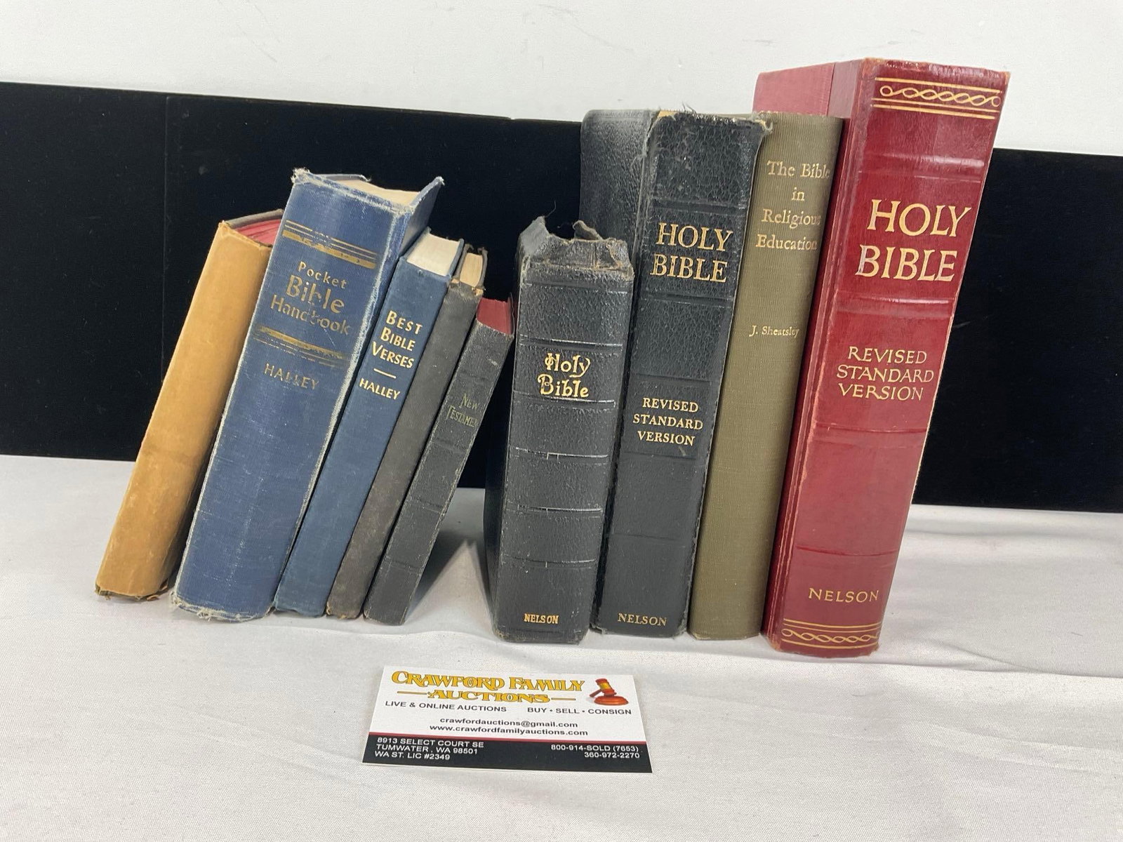 Set of 9 Small Bibles, New Testaments, & Supplementary Religious Books: Shows some wear on the covers, and the binding of a few of the pieces. See pics for condition. Measures approx 8h x 10w x 7d inches. E-6610