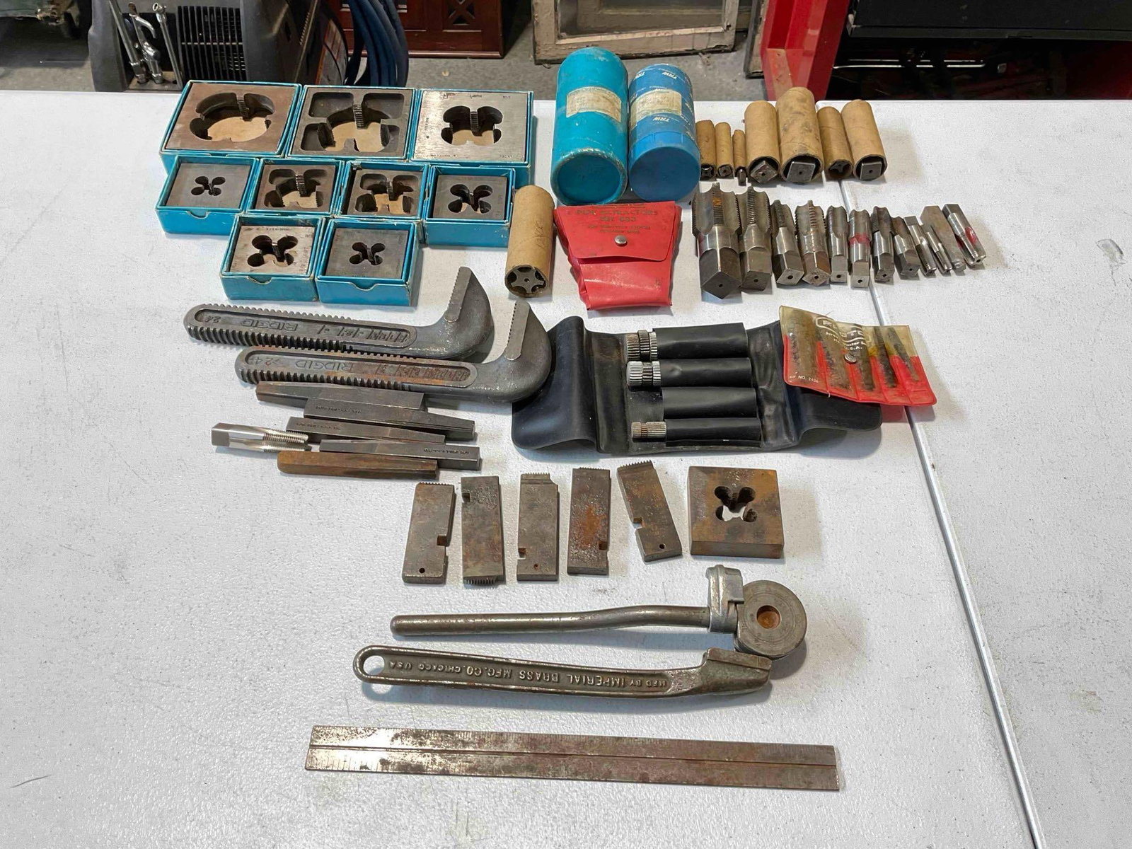 50+ pcs Machinist & Plumbing Tool Assortment, incl. RIDGID Pipe Wrenches, Taps, Dies & More!: 50+ pcs Machinist & Plumbing Tool Assortment, incl. RIDGID Pipe Wrenches, Taps, Dies & More! Pieces have wear indicative of age and use, look to photos for condition. Fits in box measuring