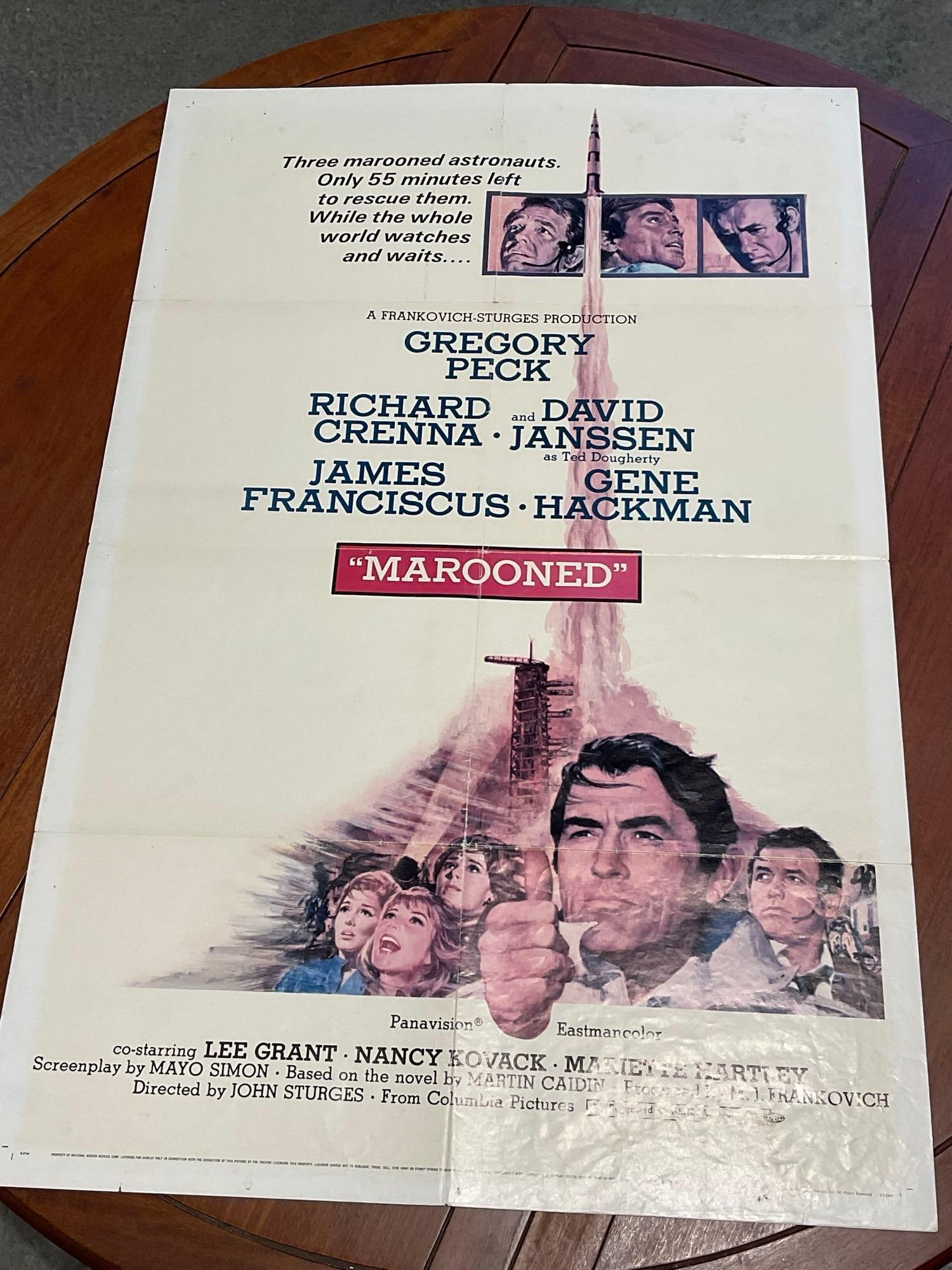 Vintage One Sheet Movie Poster, 1969 Marooned, Cast Faces on Rocket Launch stylized illustration: Vintage posters are in as is condition, consistent with age, see pics for condition. Some wear along the fold marks. The poster measures approx 41h x 27w x 1d inches when laid flat. E-6640