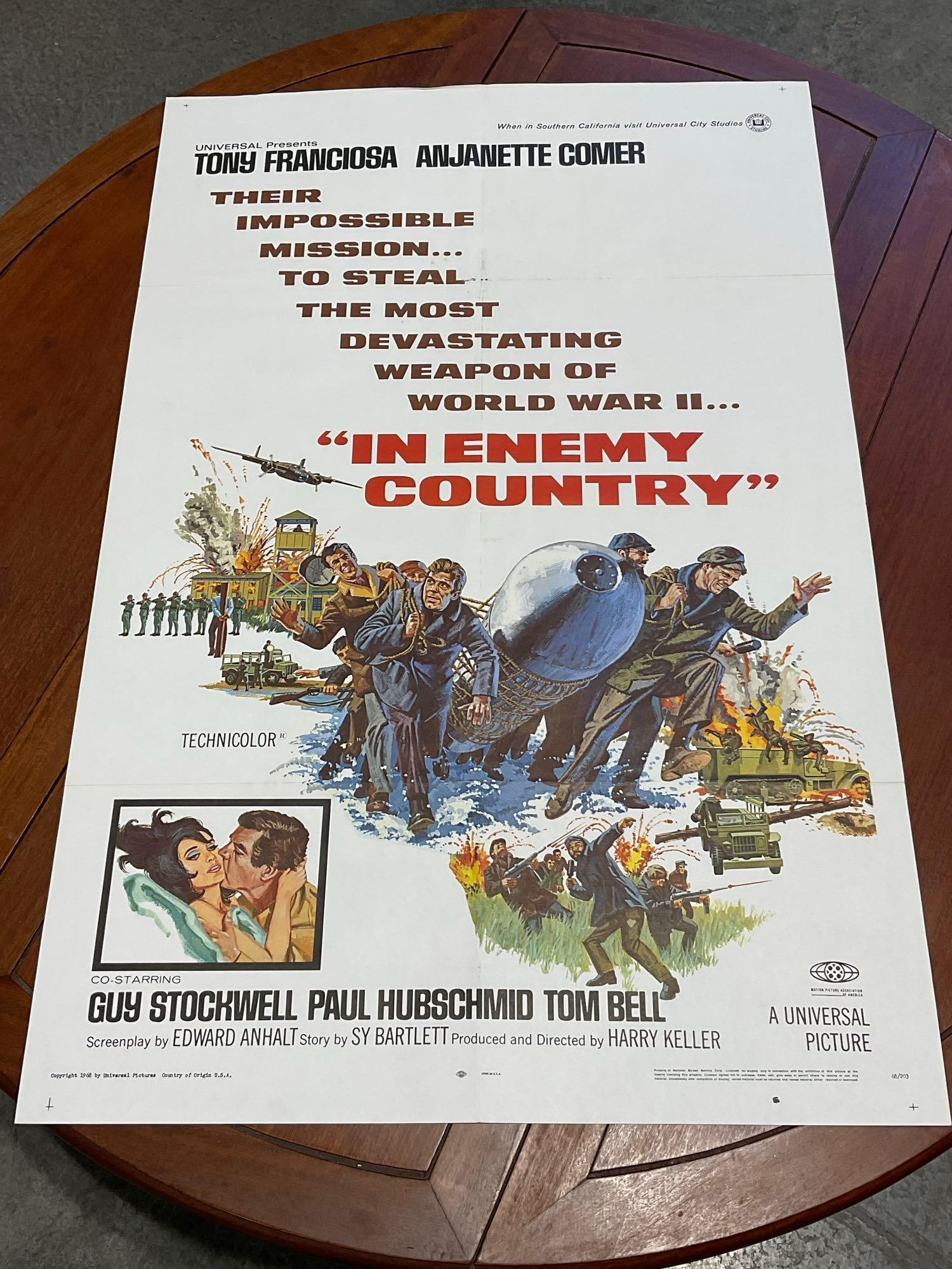 Vintage One Sheet Movie Poster, 1968 In Enemy Country, Soldiers Hauling a Big Missile on front: Marked 68/203. Vintage posters are in as is condition, consistent with age, see pics for condition. Some wear along the fold marks, some discoloration on the back of the top quarter. The poster