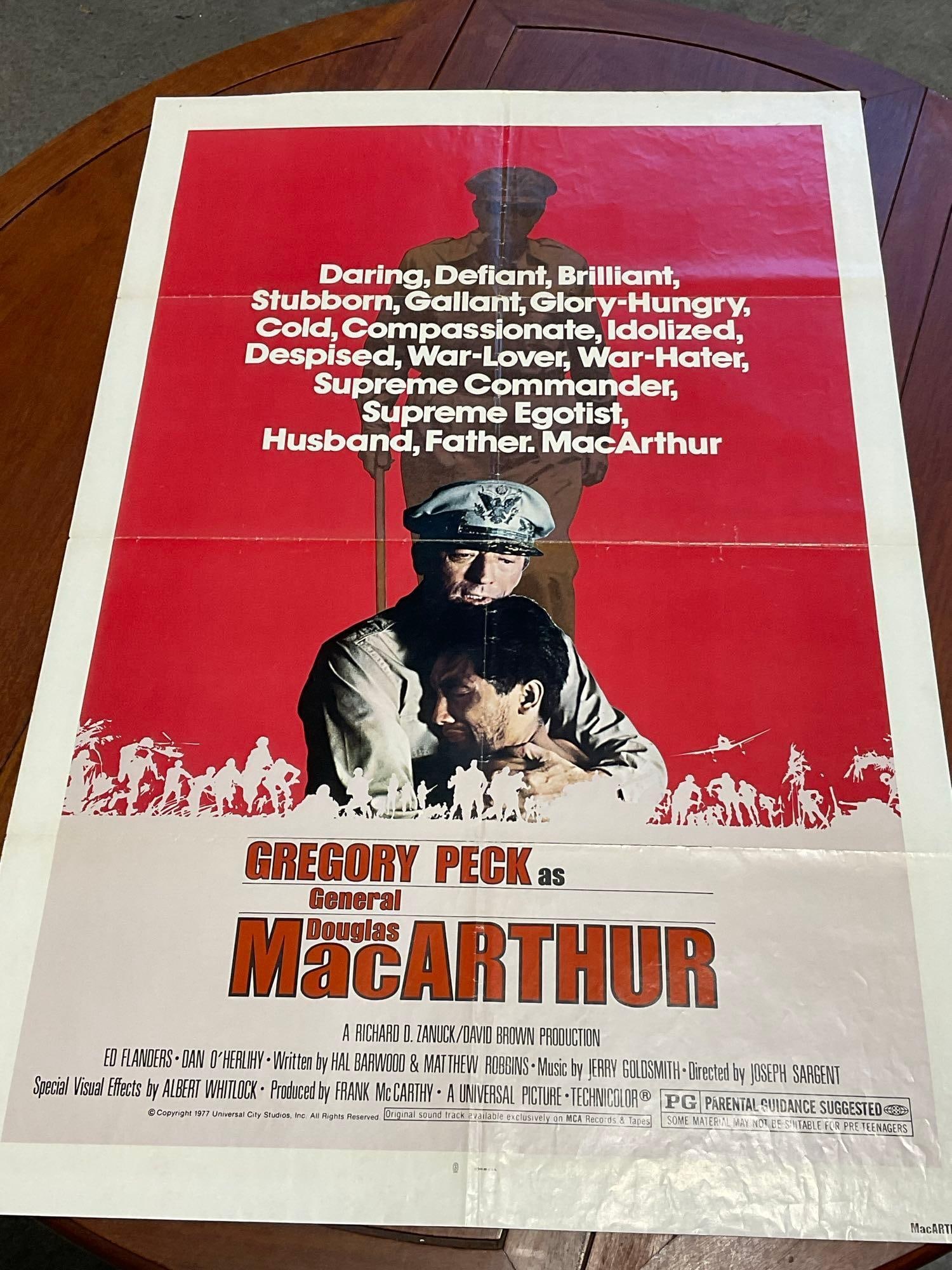 Vintage One Sheet Movie Poster, 1977 MacArthur, Gregory Peck in center, w/Deep Red/White Background: Vintage posters are in as is condition, consistent with age, see pics for condition. Some wear along the fold marks. Tape on some small holes on each of the common tear points, along the folds. The