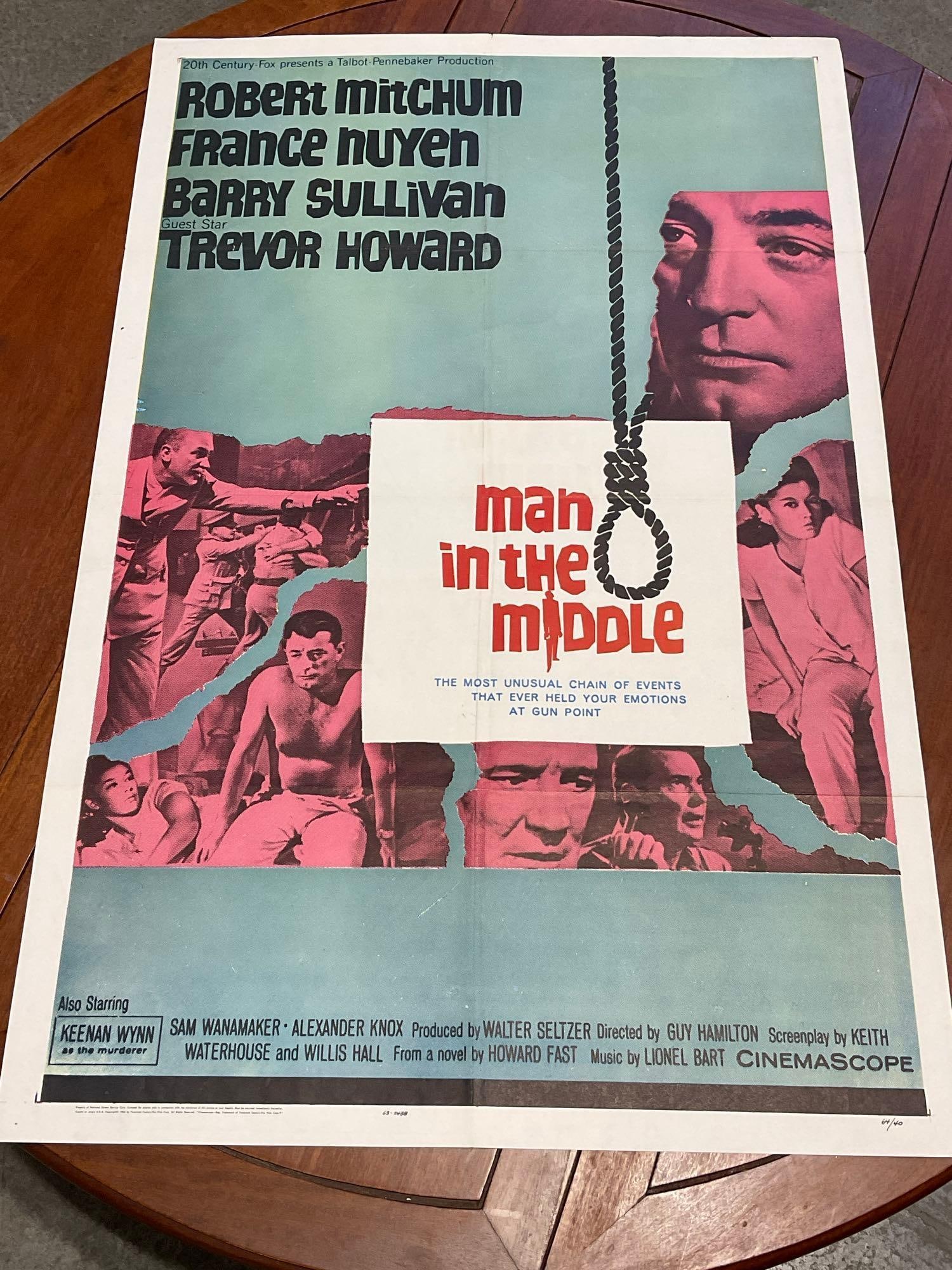 Vintage One Sheet Movie Poster, 1964 Man In The Middle, Photos of Characters in Pale Blue/Red Scale: Vintage posters are in as is condition, consistent with age, see pics for condition. Some wear along the fold marks, some small tears. The poster measures approx 41h x 27w x 1d inches when