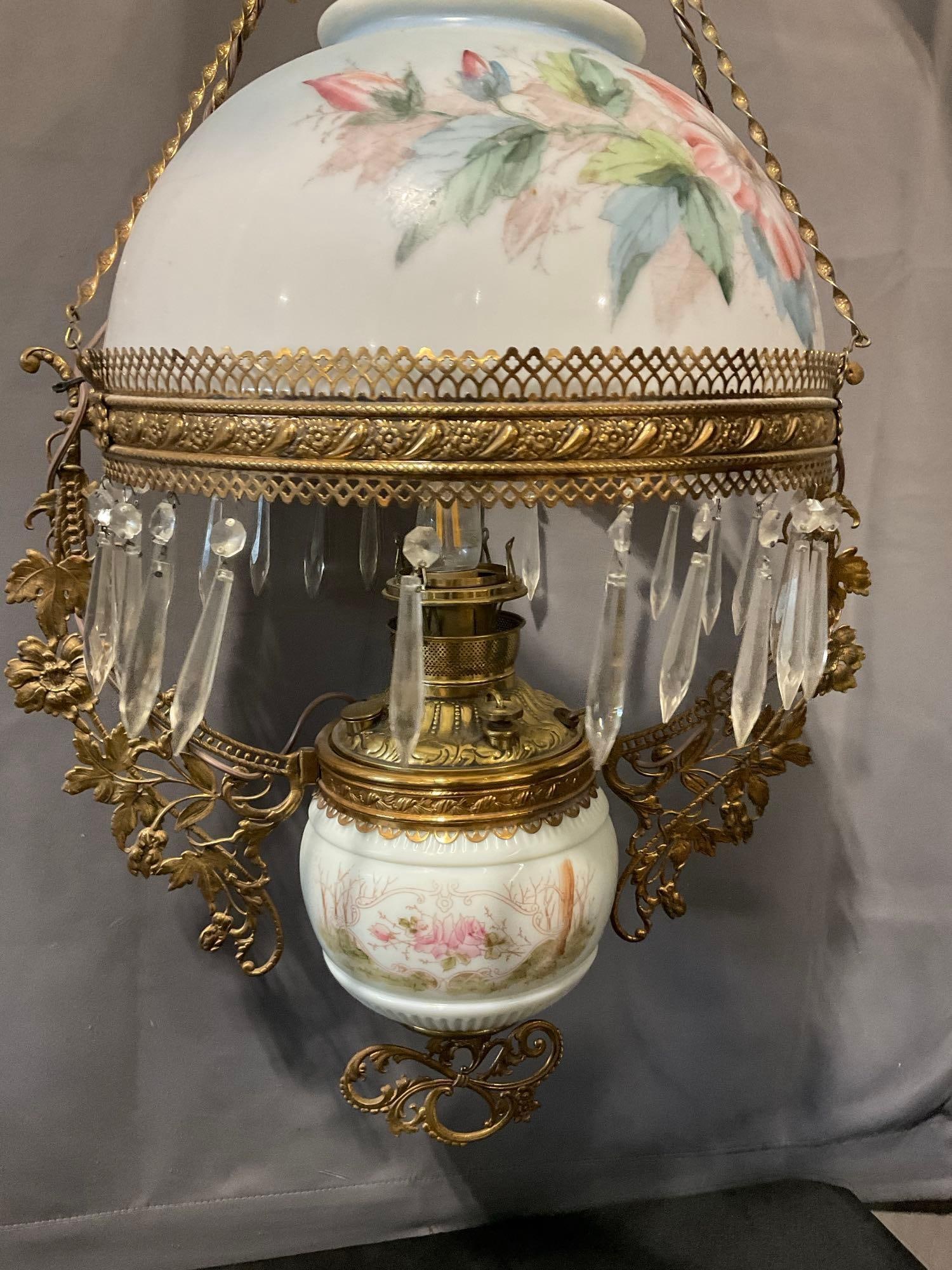 19th Century Victorian Era Edward Miller & Co. Hanging Electrified Parlor Lamp, Painted Milk Glass: Includes prisms, the chimney, the shade. Electrified. The piece should be set up by a lighting pro, seems like it is missing a mount to attach to the ceiling. See pics for condition. Measures approx