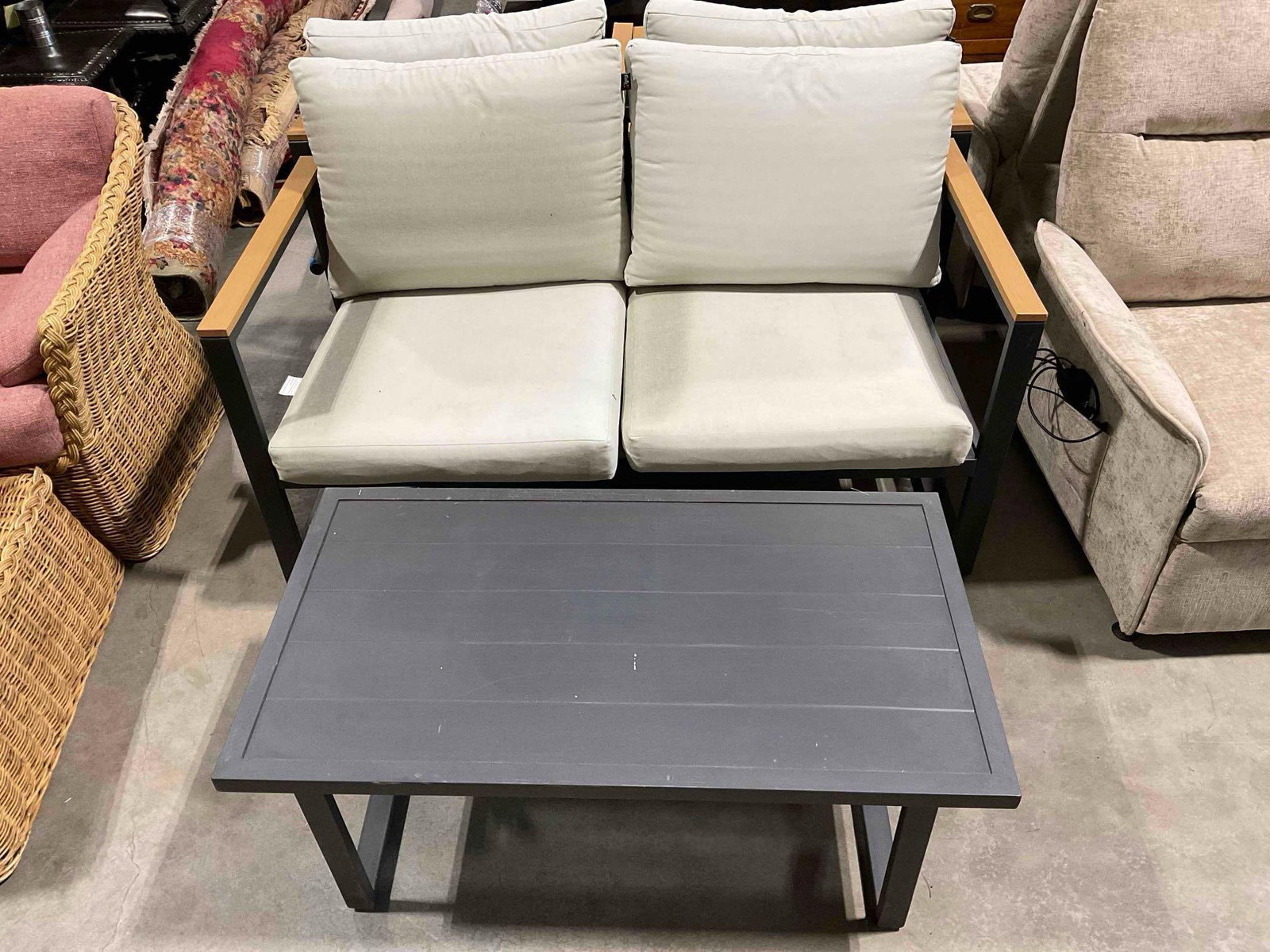 Black Aluminum Metal Patio Bench & Table Set w/ Off White Cushions & Wood Finish Detail.: Black Aluminum Metal Patio Bench & Table Set w/ Off White Cushions & Wood Finish Detail. Has been stored outside, pillowcases are stained and need a wash, table has some scrapes, see photos