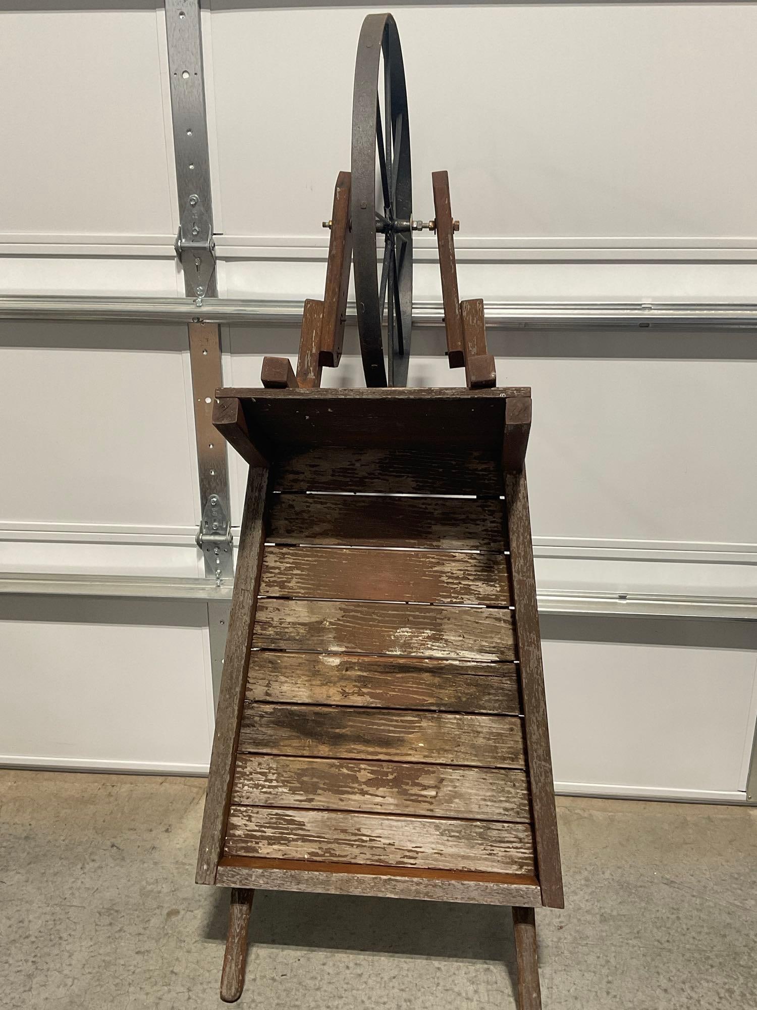Wooden Cart w/Metal Wheel, Outdoor Garden piece, approx 65x25x25 inches: Some lost finish on the top. See pics for condition. Measures approx 65h x 25w x 25d inches. E-6420 *Freight Required if shipped, Buyer Arranged/Responsibility*