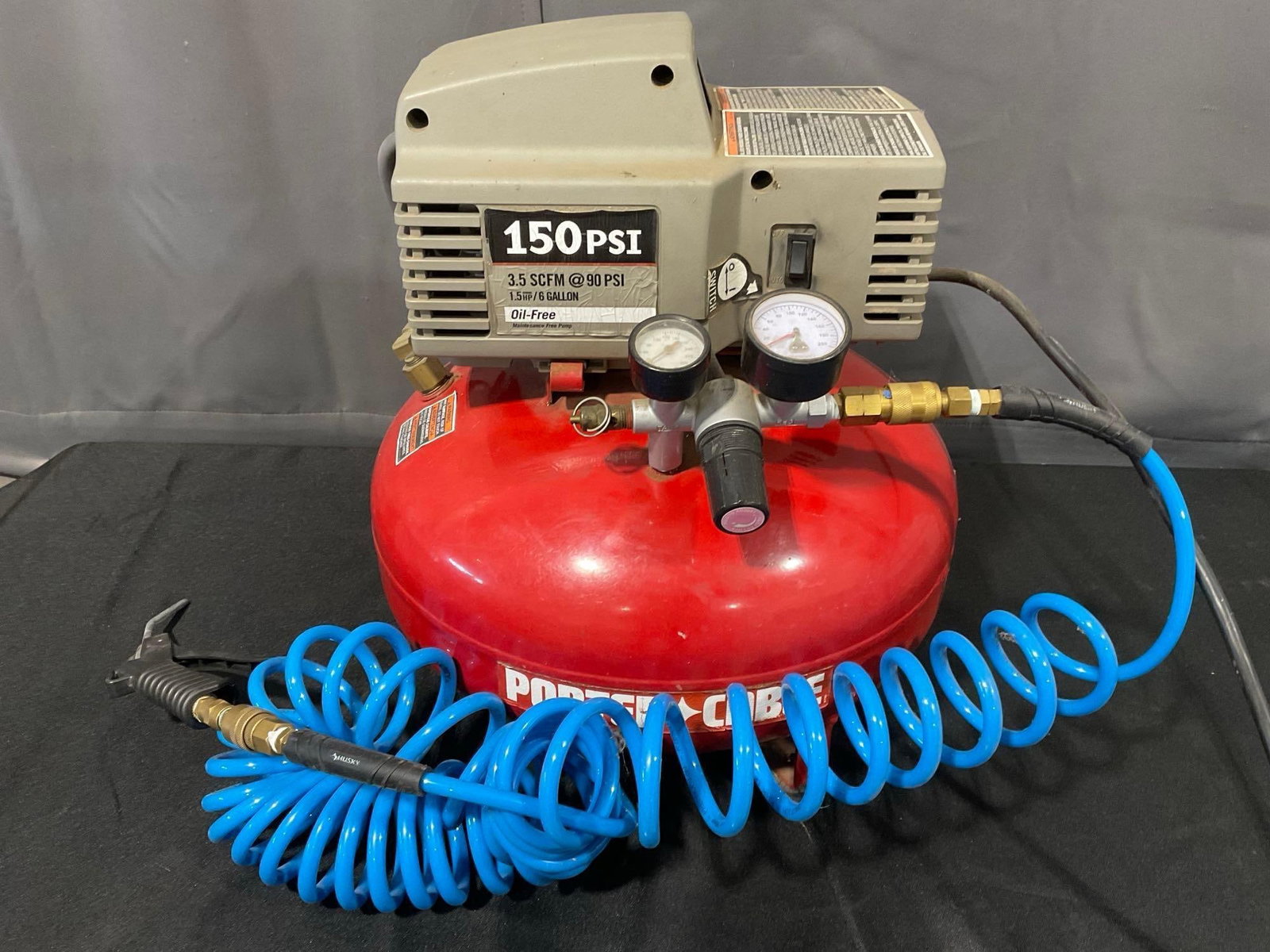 Porter Cable 6 Gallon Pancake Air Compressor, model C2001-WK, 150PSI, Oil Free, w/hose: See pics for condition. Measures approx 19h x 17w x 17d inches. E-6420 *Freight Required if shipped, Buyer Arranged/Responsibility*
