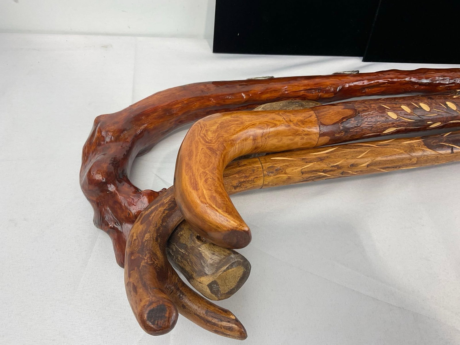 4 Rustic Handcrafted Walking Sticks, w/Leaf & Floral carved designs 34-38 inches long - 2