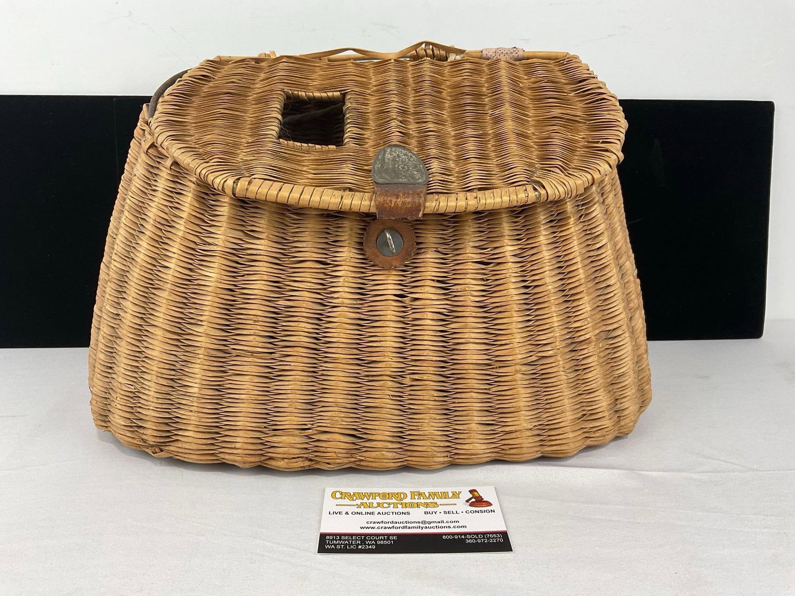 Vintage Handwoven Creel Fishing Basket, Reed & Grass construction, some wear: Some wear can be seen, the leather clasp seems to be missing. See pics for condition. Measures approx 10h x 14w x 6d inches. E-6420