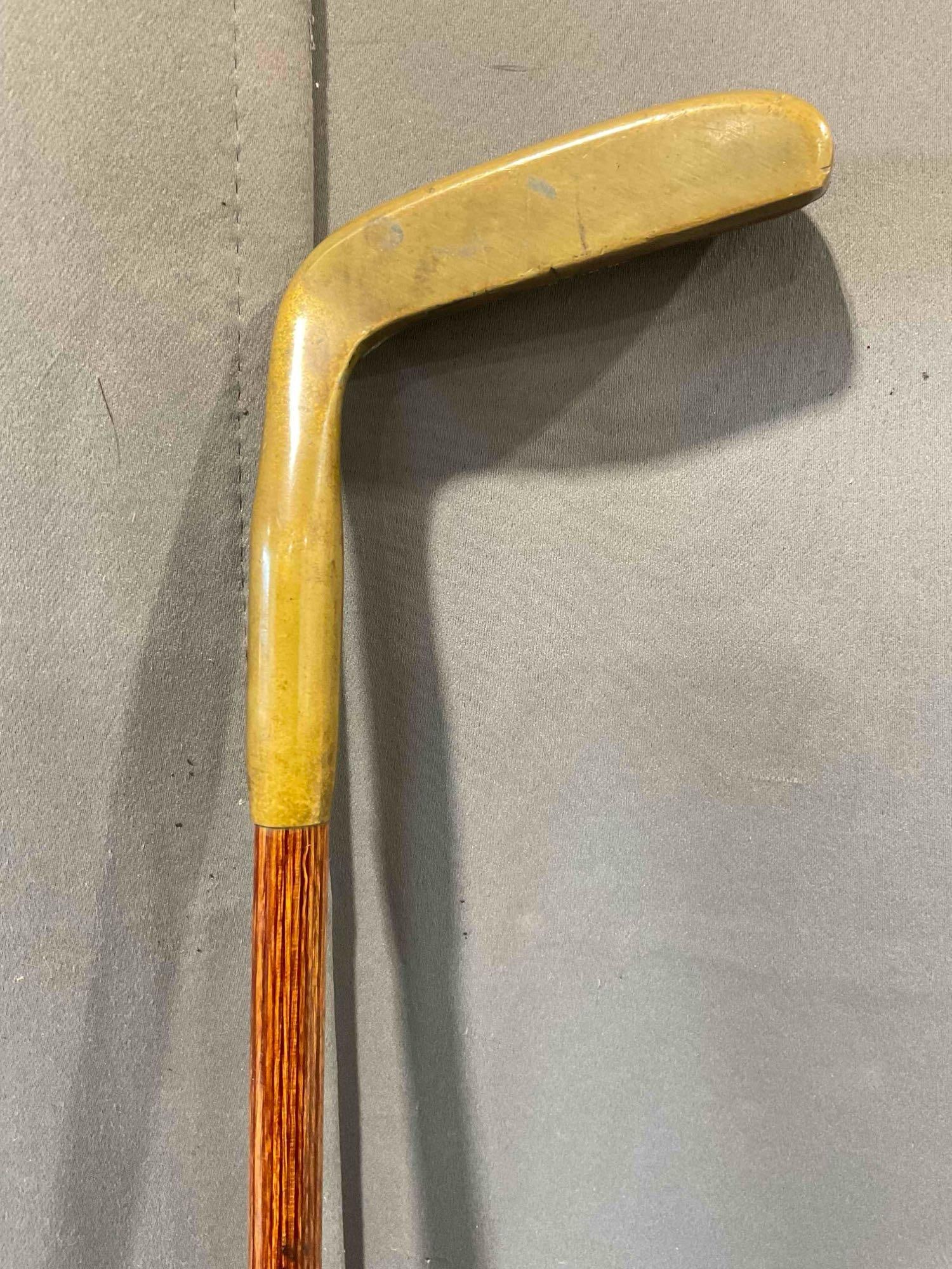 Vintage Wood Wand Handsome Brass & Walnut? Wood Putter Golf Club Iron Model 895.: Vintage Wood Wand Handsome Brass & Walnut? Wood Putter Golf Club Iron Model 895. Minor stains and wear indicative of age and use, see photos for condition. Measures 4" x 35" x 1" DM-6300