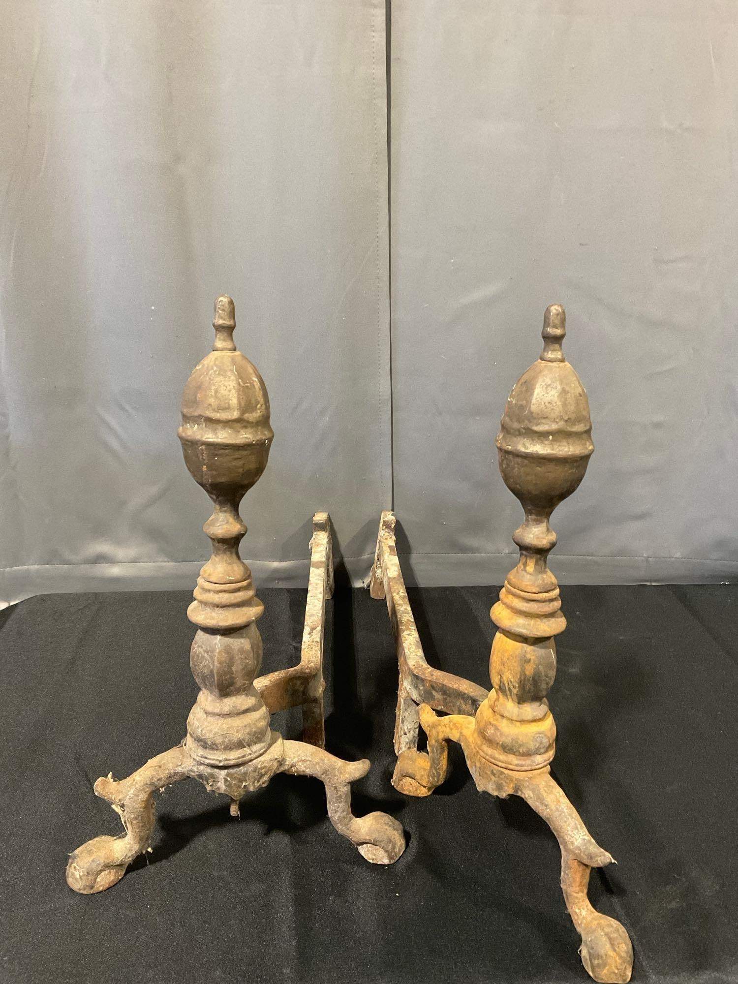 Pair of Antique Cast Iron Fireplace Andirons, some lost finish, & oxidation: Appears to be in fair shape, some lost finish, and has oxidation. The piece measures approx 20h x 24w x 12d inches. See pics. E-6610 *Oversized shipping may apply*