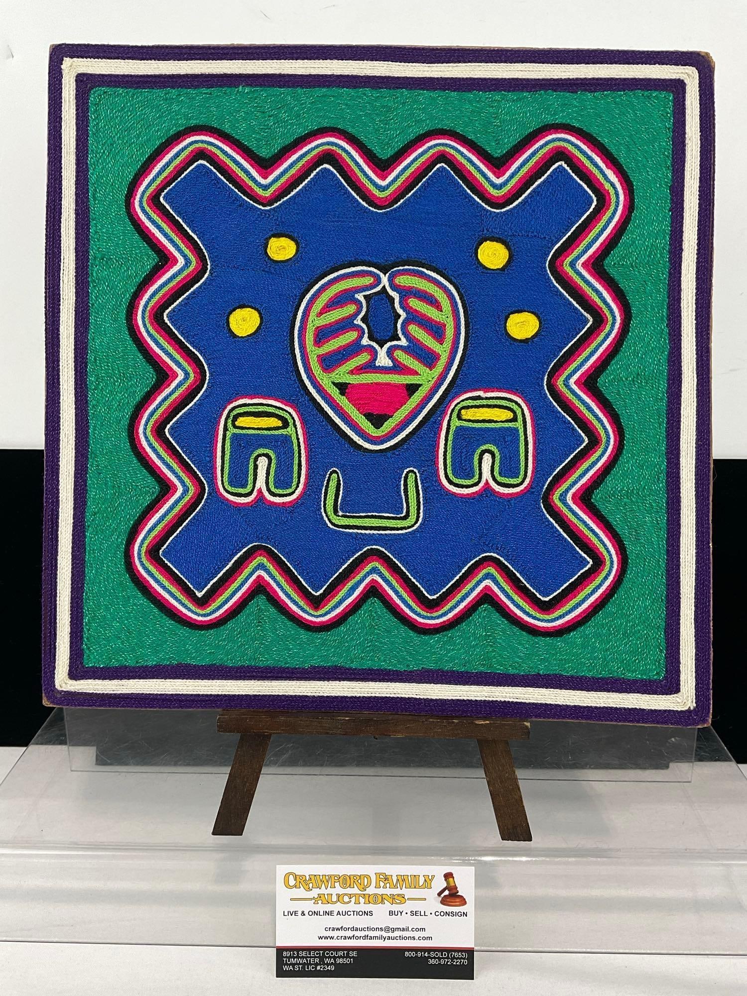 Traditional Huichol Yarn Painting on board, Mexican, signed Senorita Marisol C.H., 13x13x3 inches: Bio on the back, describing the spiritual significance of the sacred deer and its connection to shamanic drums & rituals. See pics for condition. Measures approx 13h x 13w x 3d inches. E-6620