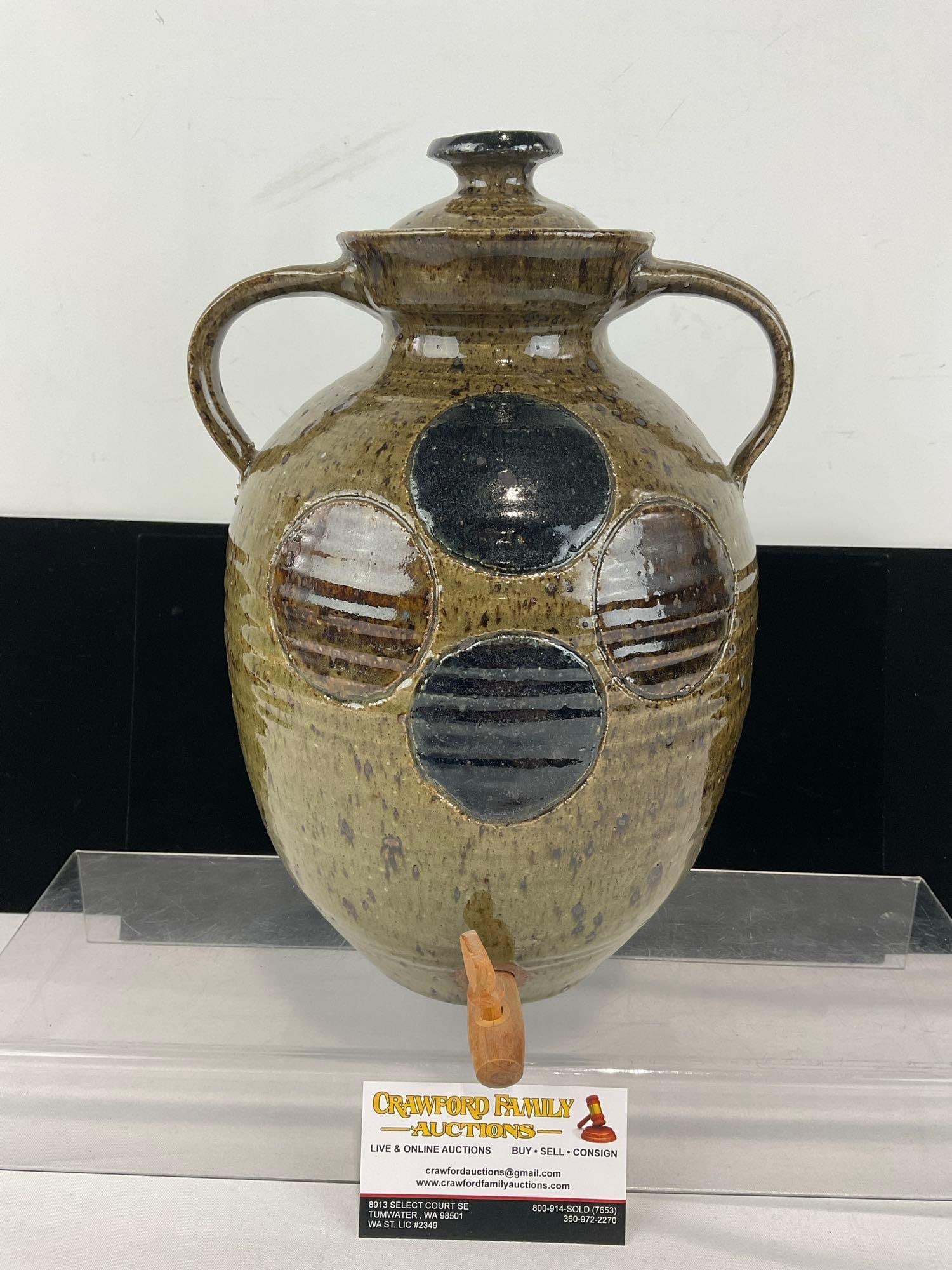 Glazed Stoneware Drink Dispenser, w/Lid, Green w/circles, 13h x 9w x 8d inches: Looks like it is signed Wyatt 8/71 or something similar. See pics for condition. Measures approx 13h x 9w x 8d inches. E-6620
