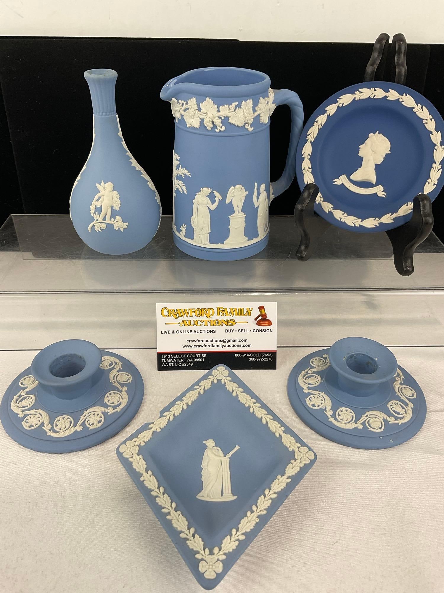 Wedgwood Jasperware, 2x Candleholders, Diamond Plate, Round Plate, Small Pitcher & Amphora Vase: White overlay on Pale Blue. One chip on the rim of the diamond shaped plate. See pics for condition. Measures approx 8h x 9w x 9d inches. E-6620