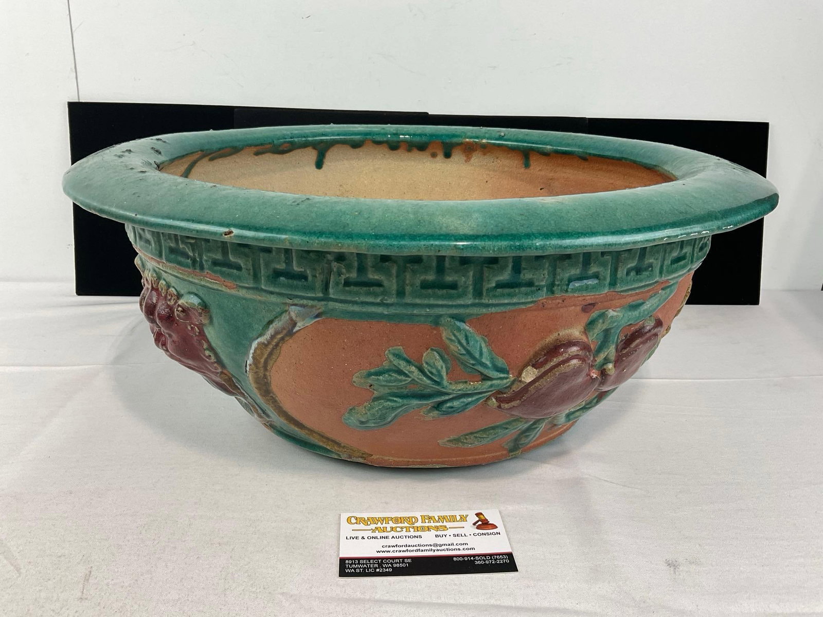 Large Chinese Terracotta Decorative Planter, Teal & Earthy Ochre, w/Red Lion & Flower design: Some chipping along the edge, and some lost finish & cracking on the bottom. See pics for condition. Measures approx 8h x 19w x 19d inches. E-6520