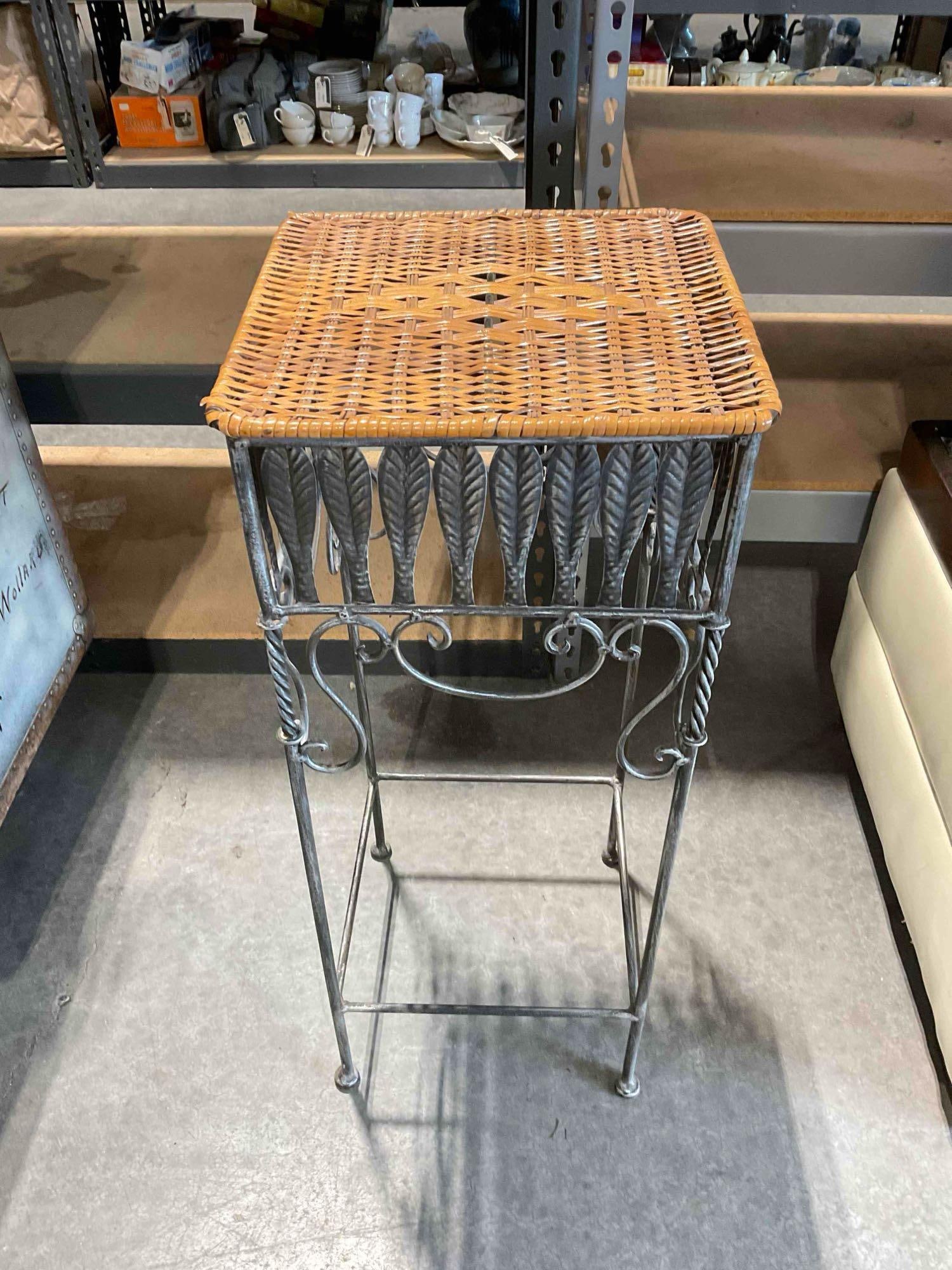 Handsome Wrought Metal Plant Stand w/ Woven Wicker Top. Stands 29" Tall! See pics.: Handsome Wrought Metal Plant Stand w/ Woven Wicker Top. Stands 29" Tall! Measures 12" x 12" x 29" Minor wear indicative of age and use, wicker has some torn parts, see photos for condition. DM-6290&nb
