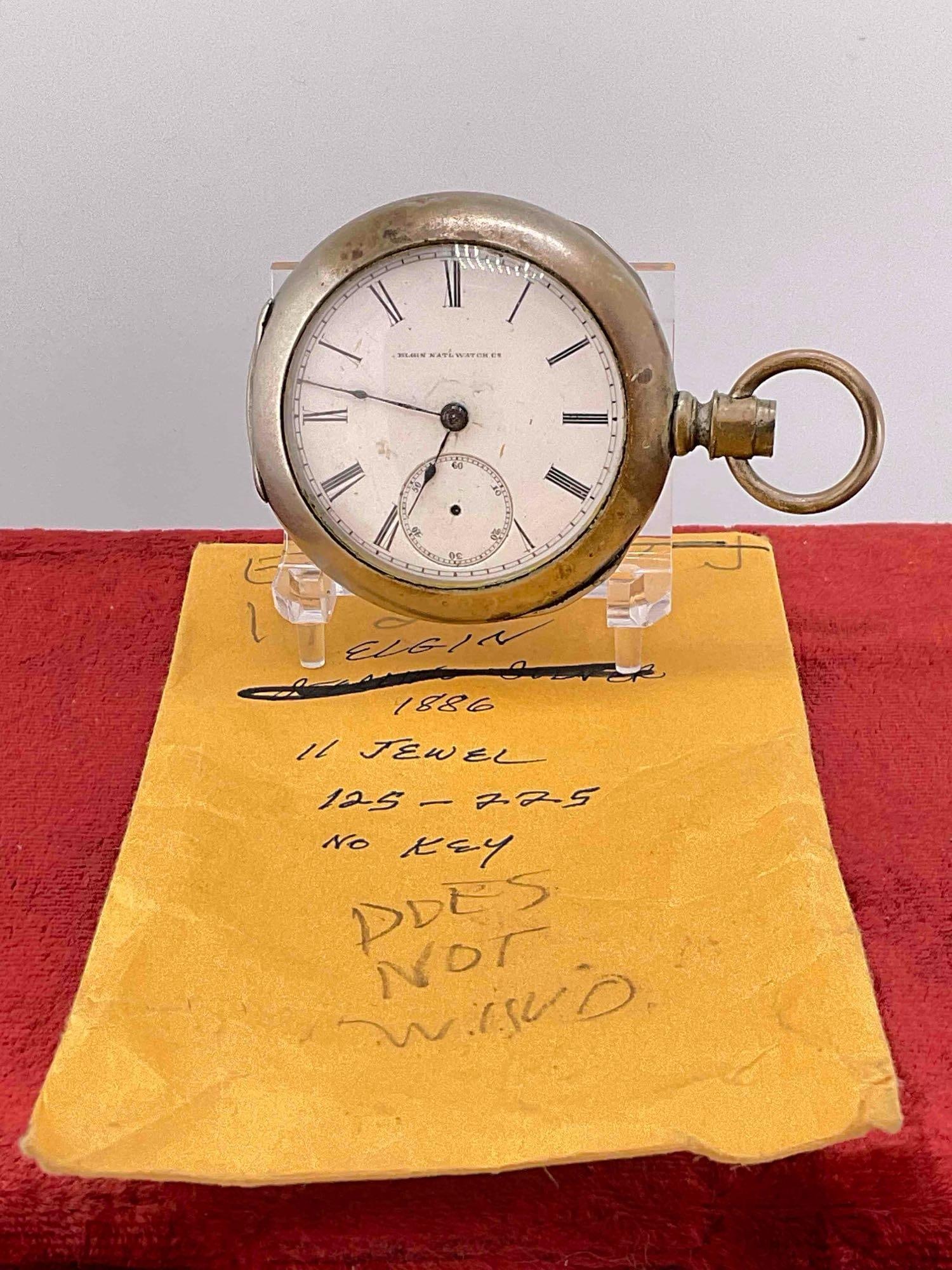 Antique 1886 Elgin Pocket watch sz 18s , 11 Jewels, grade 10, # 1915314 w/ silverine case: c-6600 Watch does not run Sold as is , needs service and repair. missing the stem & second hand, glass face will not open. 3 pc case is marked Dueber