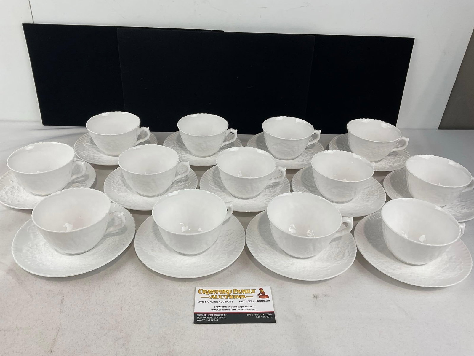 Spode China Savoy White Pattern, Cabbage Leaf design, 13 cups & 13 saucers: One or two small chips on the rims of the cups. See pics for condition. Measures approx 11h x 14w x 12d inches. E-6620