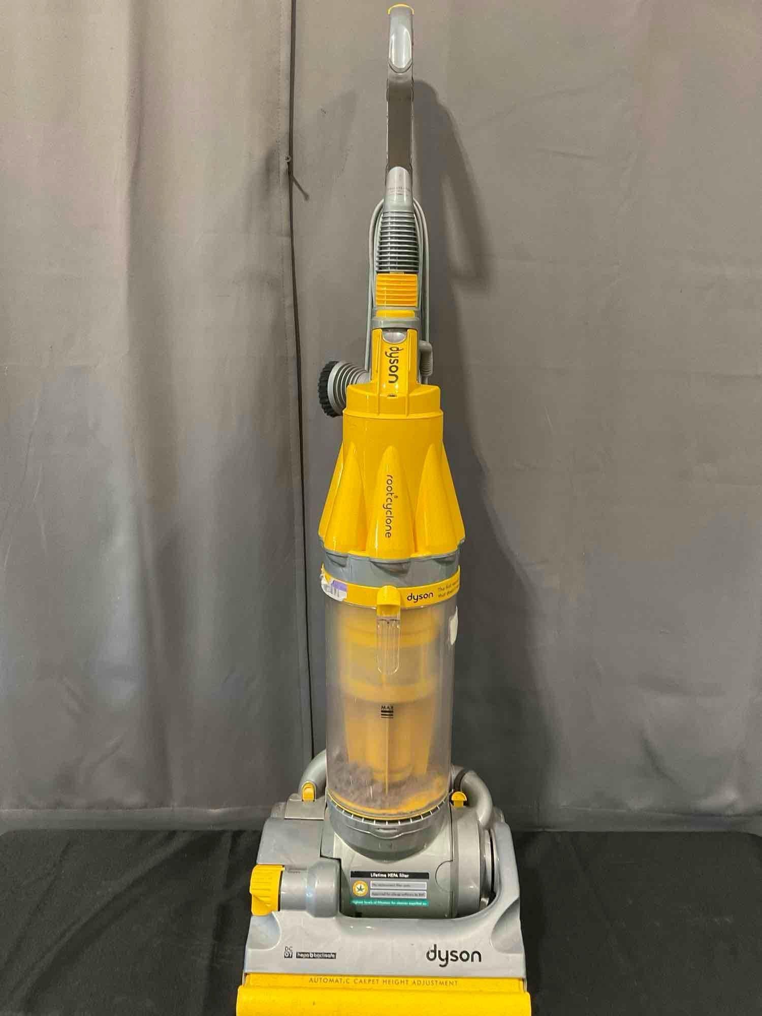 Dyson Vacuum model DC07 Bagless Upright Vacuum, Yellow/Silver: Has been used, could need some cleaning. See pics for condition. Measures approx 48h x 15w x 16d inches. E-6290 *Freight Required if shipped, Buyer Arranged/Responsibility*