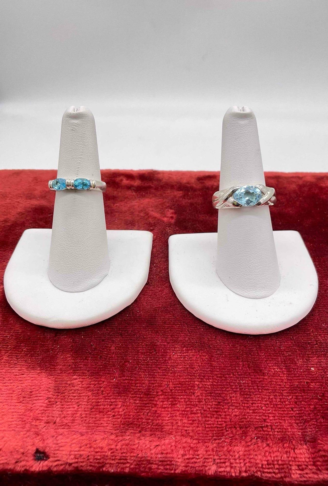 2 x .925 sterling silver women's rings with Blue Topaz settings Marked SAE 9.25 & Ln .925: c-6630 Single stone ring SAE .925 has an approx 1ct stone sz 7 Double stone topaz Stone ring marked .925 CT / sz 6.5