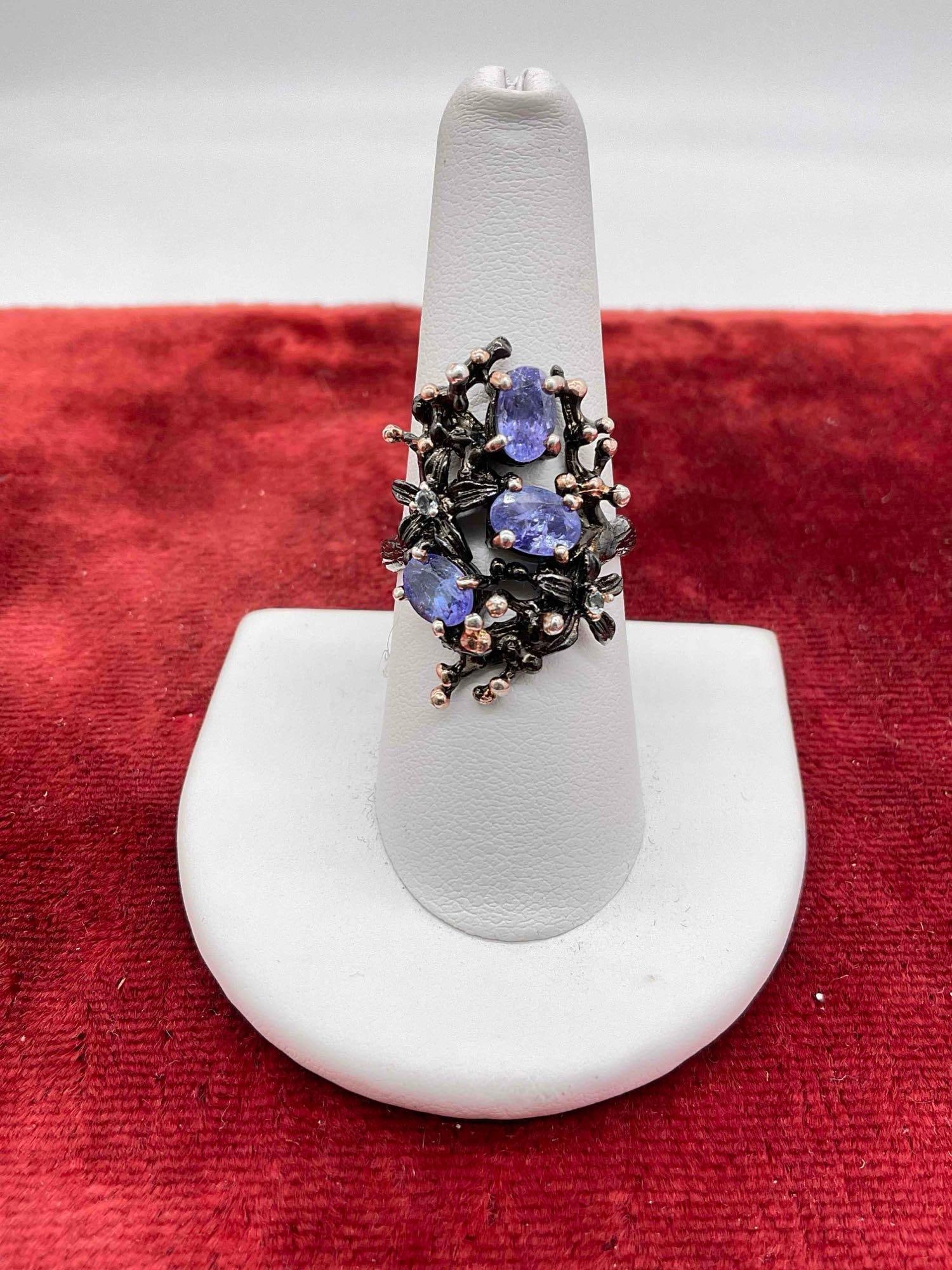Nature inspired Sterling silver cocktail ring w/ 3 tanzanite stones & 2 small Diamond chips: c-6630 Nice Sterling silver ring with Black Rhodium plating ring is marked and sz 8 Stones have been tested 