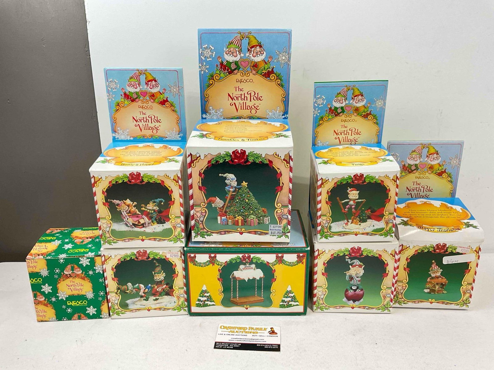 8 pcs Vintage ENESCO Composite The North Pole Village Decorative Christmas Figurines.w/ boxes: 8 pcs Vintage ENESCO Composite The North Pole Village Decorative Christmas Figurines. Pieces have wear indicative of age and use, one has a loose piece and has lost a few pieces, see photos for