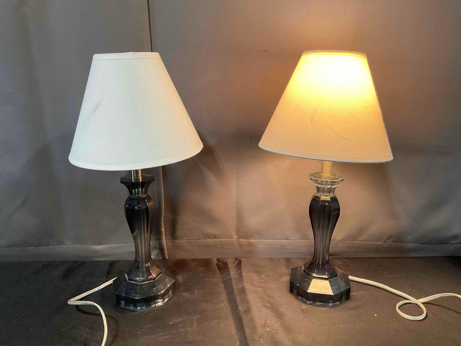 Pair of Modern Table Lamps w/ Smoked Gray Composite Bases & Cream Fabric Shades. Work.: Pair of Modern Table Lamps w/ Smoked Gray Composite Bases & Cream Fabric Shades. tested, both Work, one has a burnt out bulb, minor wear to shades, see pictures for condition. Measures 9" x 9" x