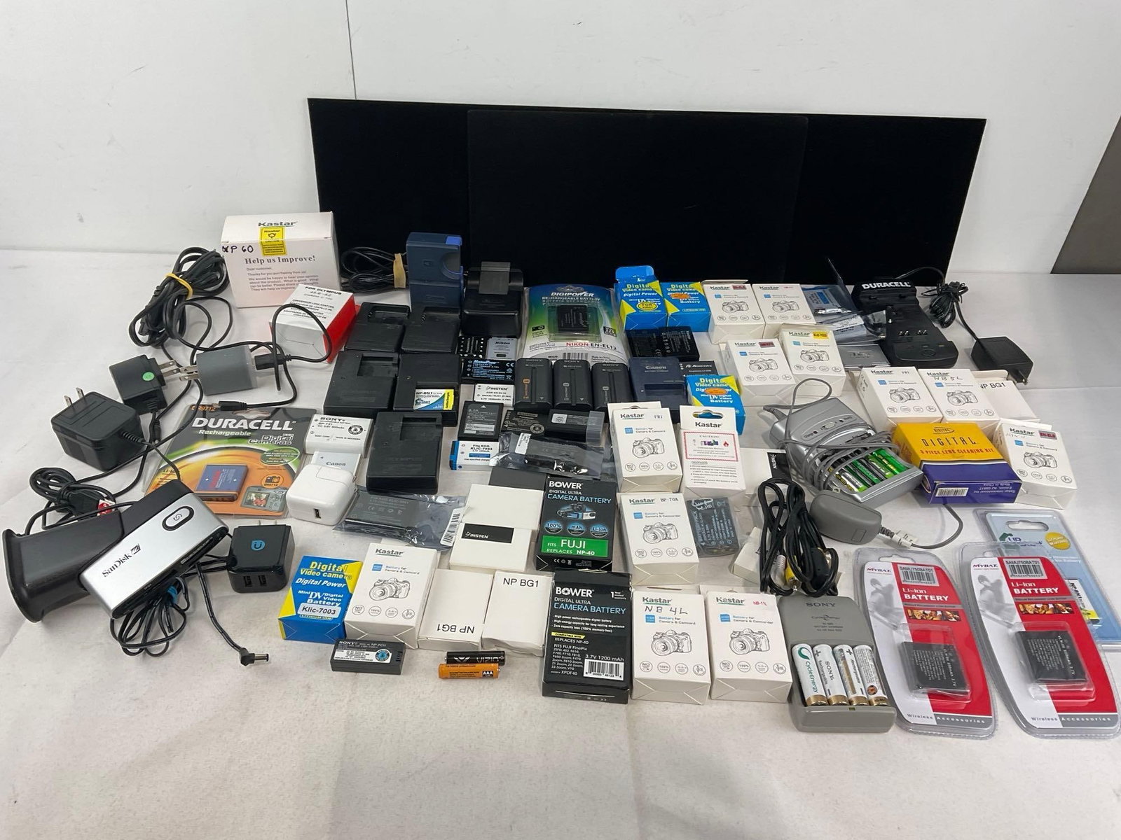 Assortment of Camera & Camcorder Batteries, Canon, Nikon, & offbrand pieces: Likely no shipping for these, many kinds of battery that cannot be air shipped. See pics for condition. Measures approx 12h x 16w x 12d inches. E-4320