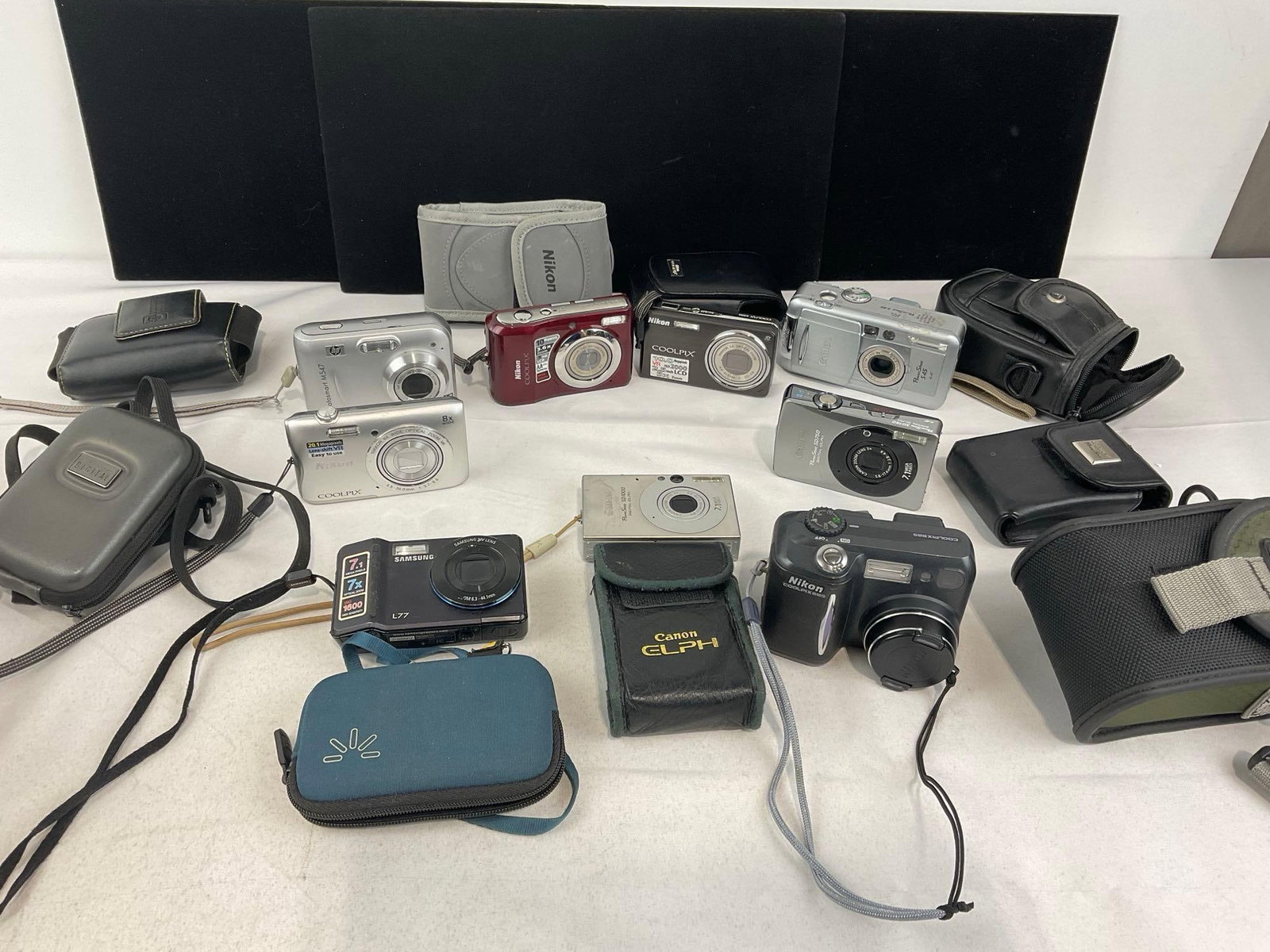 Variety of Digital Cameras, several Nikon Coolpix, Samsung L77, Canon PowerShot SD750 & SD1000 (1 of 12)