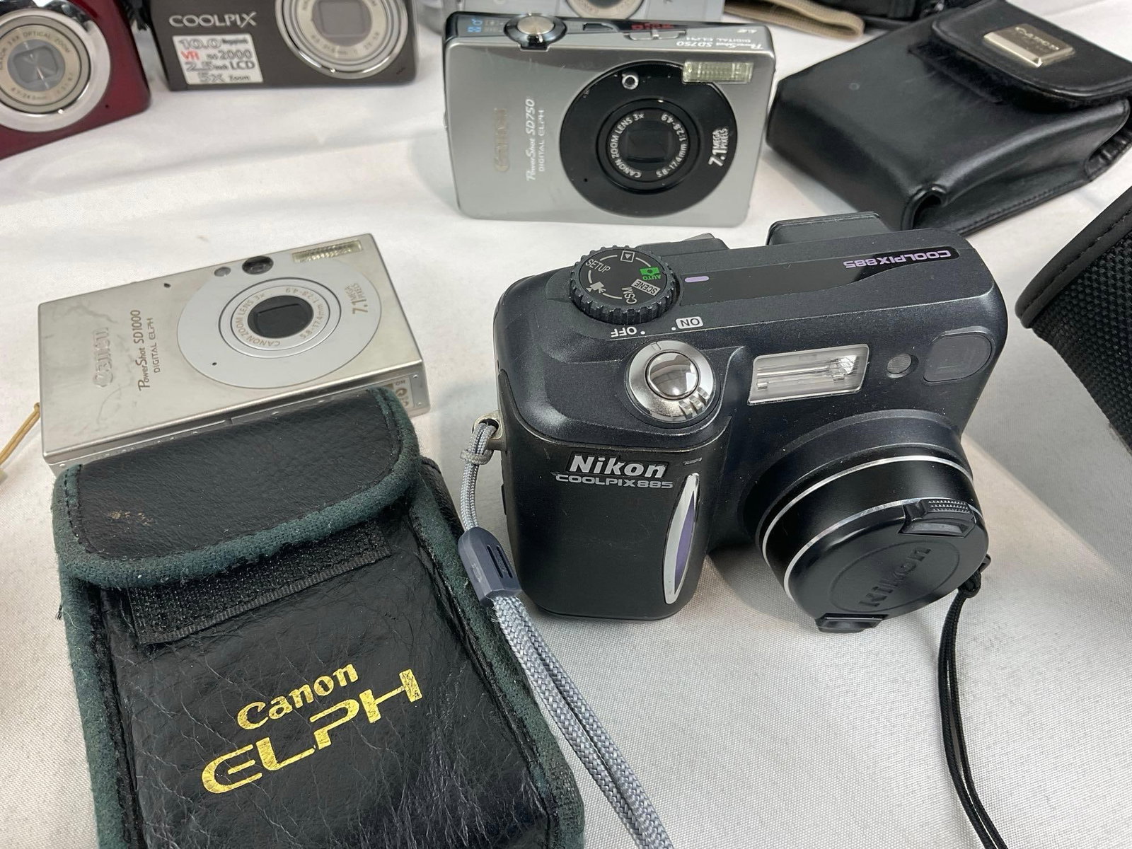 Variety of Digital Cameras, several Nikon Coolpix, Samsung L77, Canon PowerShot SD750 & SD1000 - 4