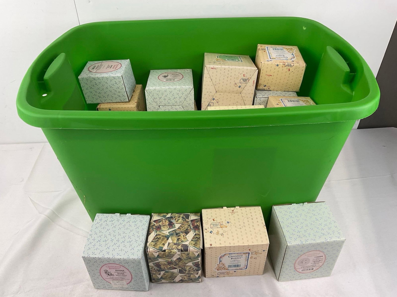 20+ Enesco Cherished Teddies Figurines in boxes: Unchecked for wear. See pics for condition. Measures approx 16h x 25w x 17d inches. E-6670