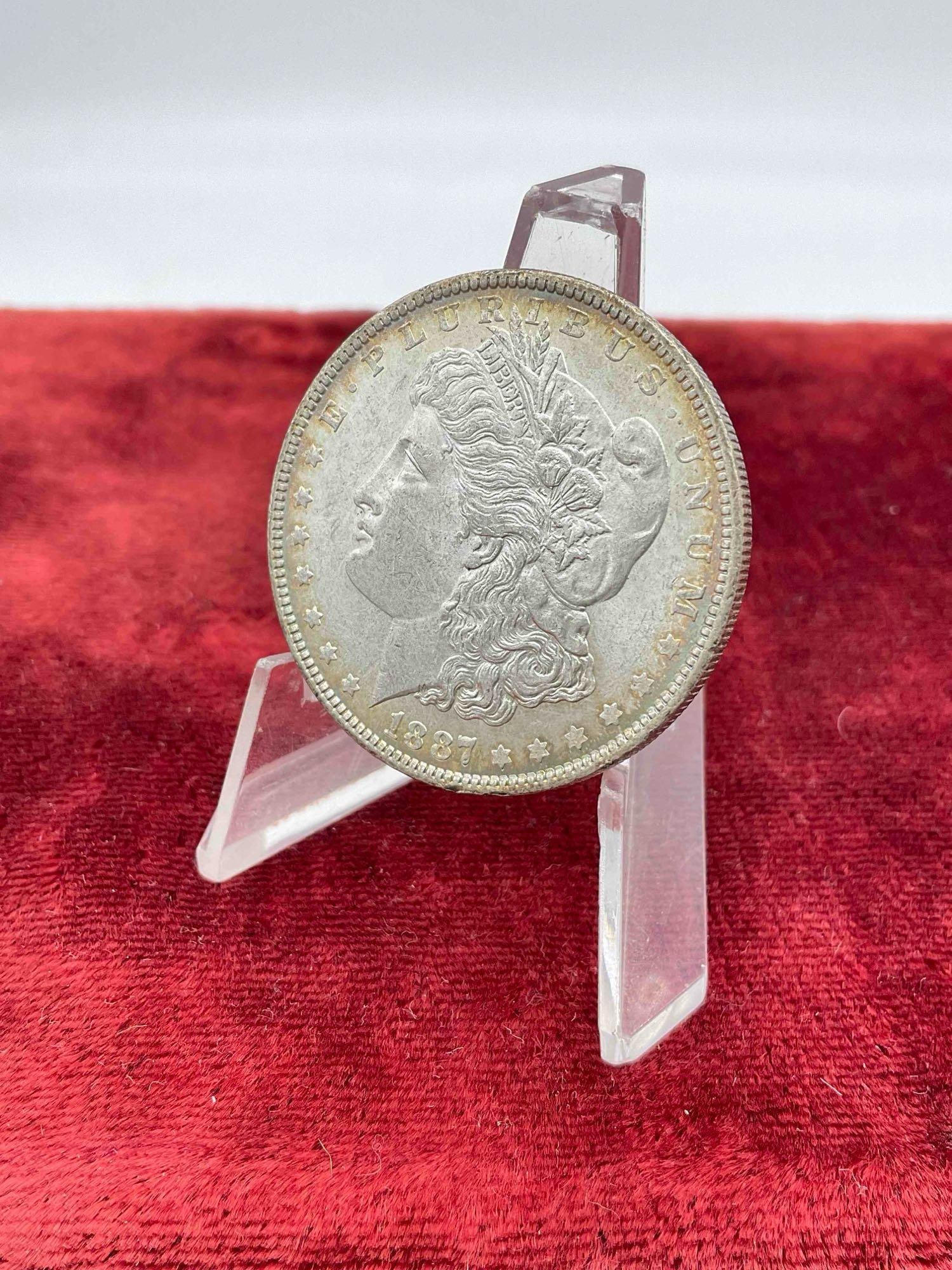 Antique 1887 Silver Morgan Dollar w/ doubling in the date and rim toning both Obverse and reverse: c-6800 Very nice Coin, is in gradable condition poss AU 