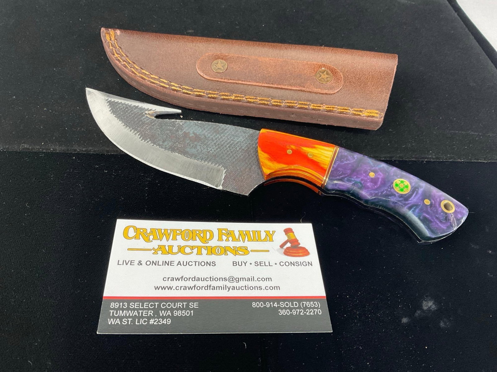 File Steel Knife w/hook, Fire Tinted Wood & Purple Resin Handle, & Leather Sheath: All these knives are from the same collection. See pics for condition. Blade measures approx 4 inches. Measures approx 10h x 4w x 2d inches. E-3440